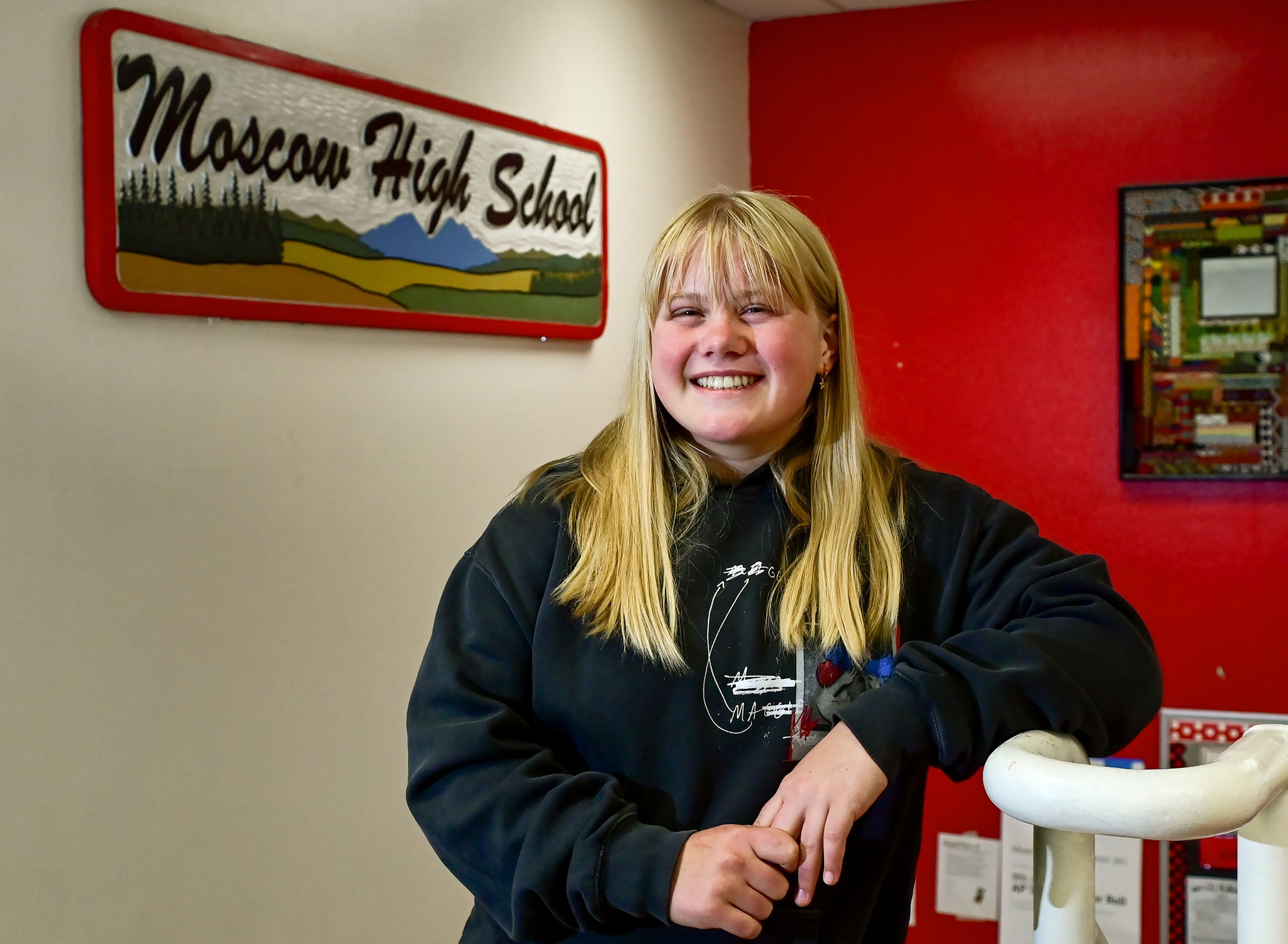 Graduating Moscow High School senior Addison Branen poses by a school sign on Tuesday. Branen is a 4.0 student who is signed to play college softball.