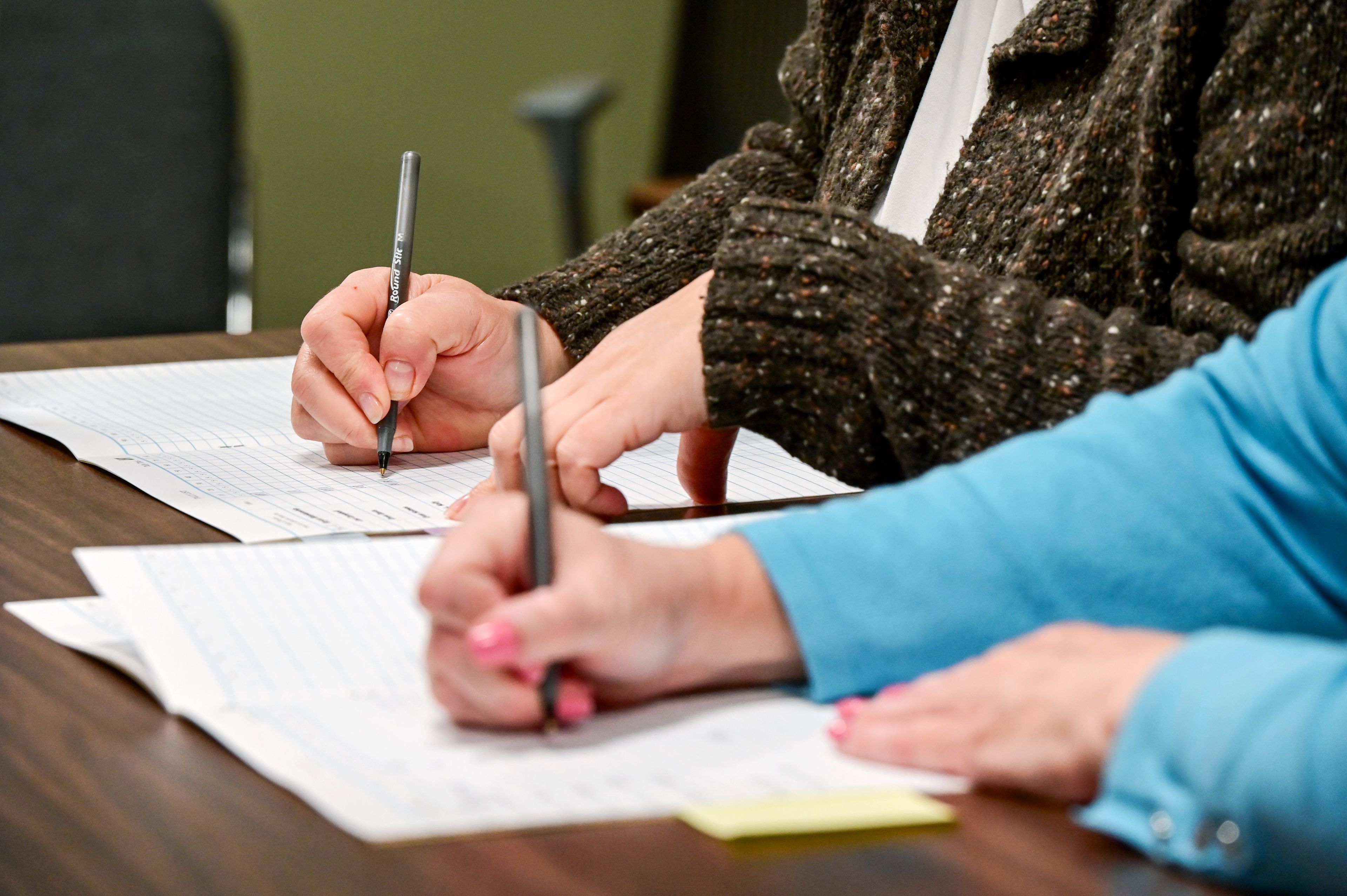 Shelley Nice, left, and Marci Mitchell tally absentee ballots was they are called out for Latah County Elections in Moscow in the afternoon on Election Day.