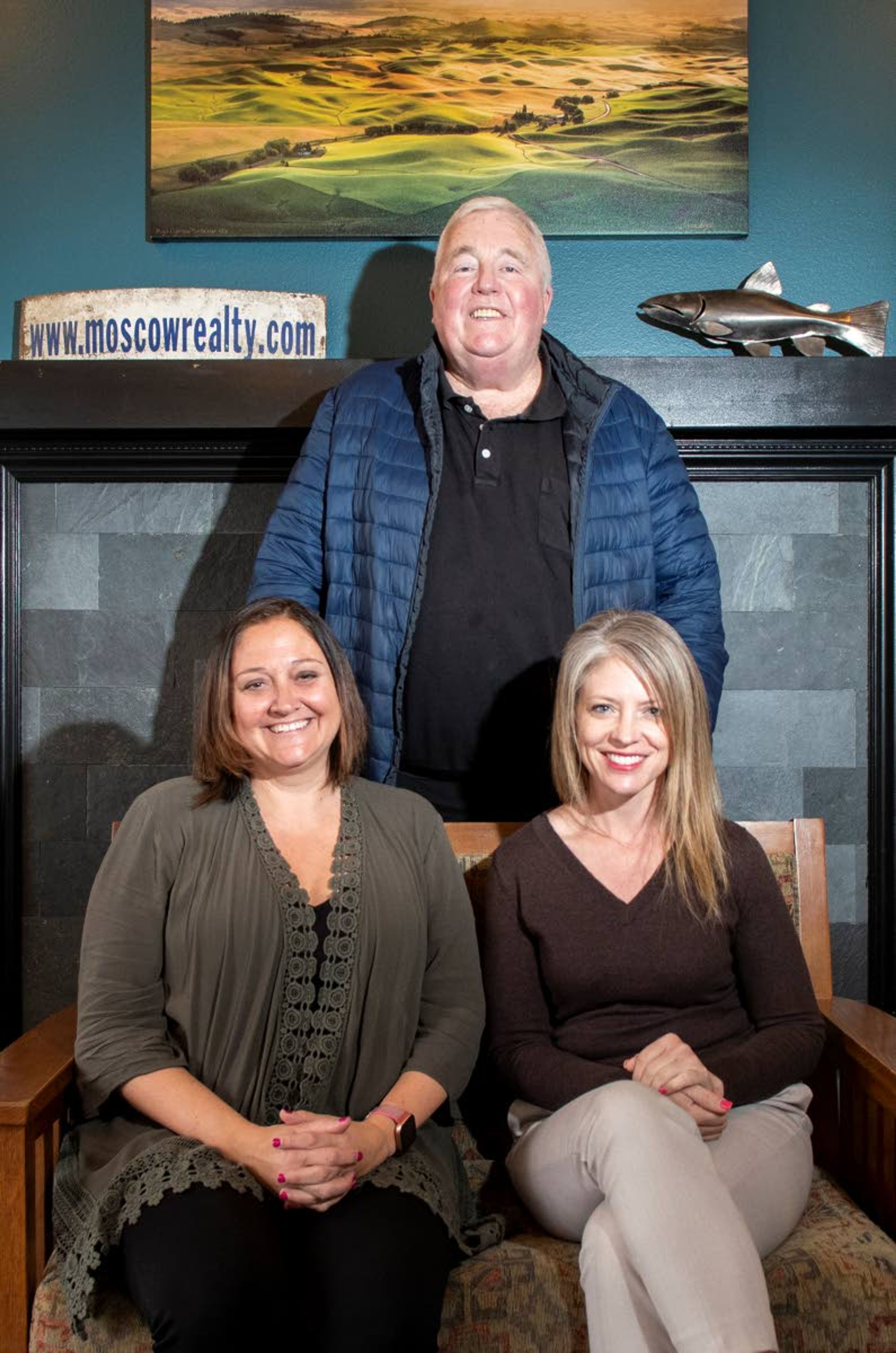 Broker and previous owner of Moscow Realty, Joe McGurkin, poses for a photo with current owners Jessica Dahlinger, left, and Sam DeVoe. DeVoe, a lifelong Moscow resident, and Dahlinger, who has spent nearly the last 25 years in town, both previously worked at Latah Realty.