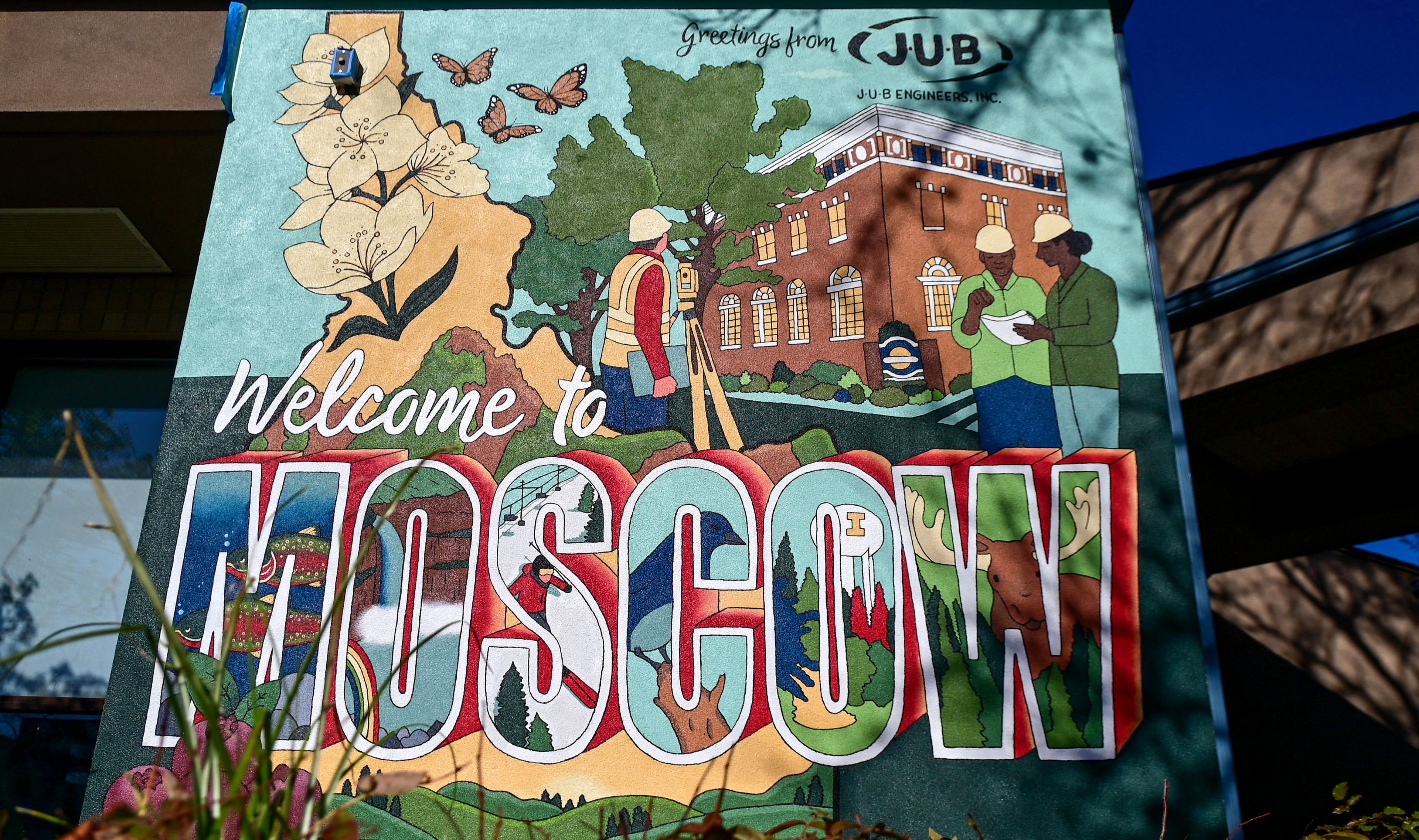 A Moscow-themed mural by University of Idaho graduate student Madelynn Gregoire is visible on the side of the J-U-B Engineers building in downtown Moscow on Monday. Sights from Moscow, including city hall and a moose, are combined with state imagery in the mural.