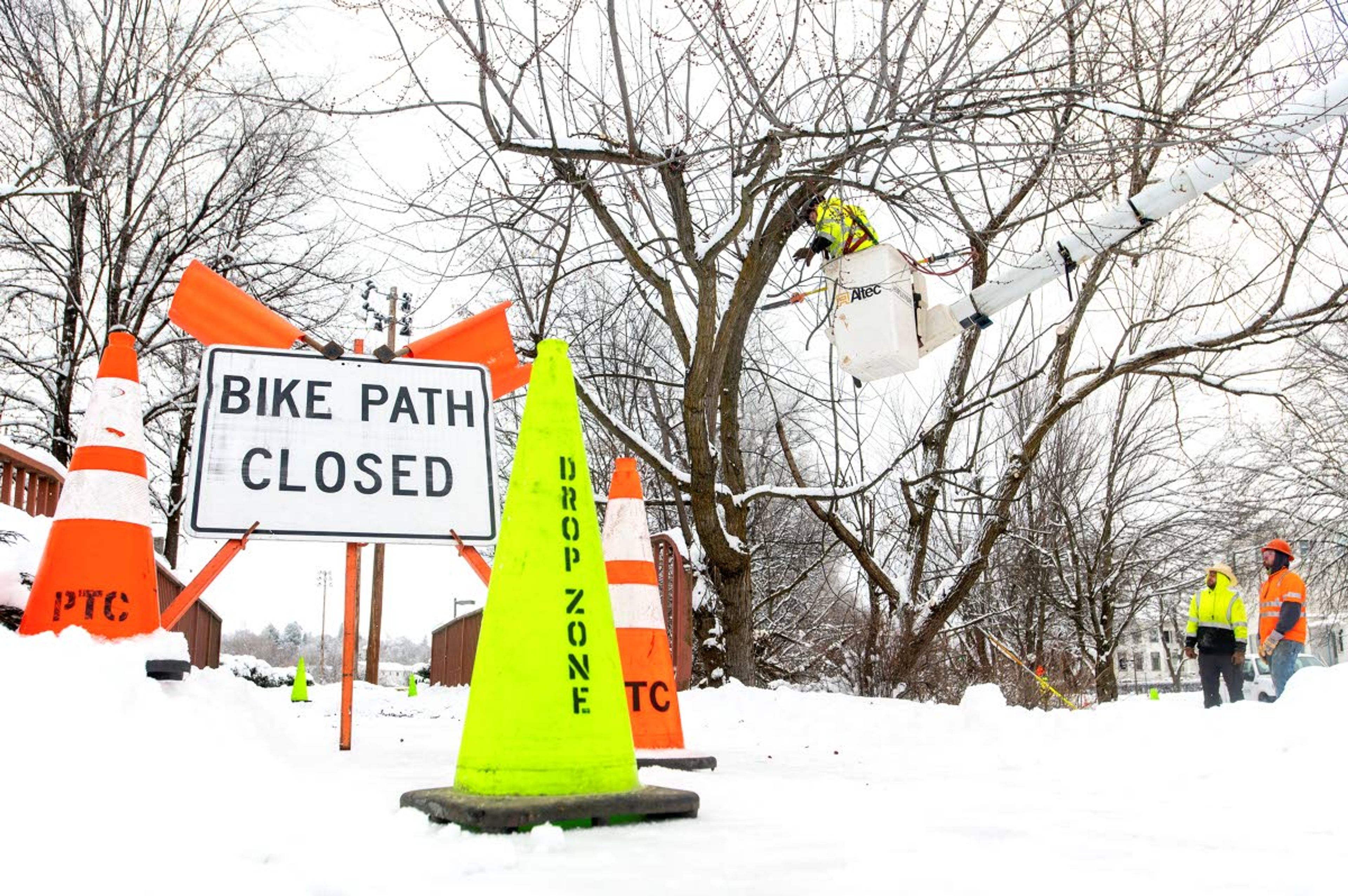 Asplundh Tree Expert employees Tanner Spence, from left, Sam Parris and Tug Jones clear tree branches near power lines at the University of Idaho in preparation for dangerously cold temperatures upon the arrival of an Arctic air mass, according to the National Weather Service in Spokane.