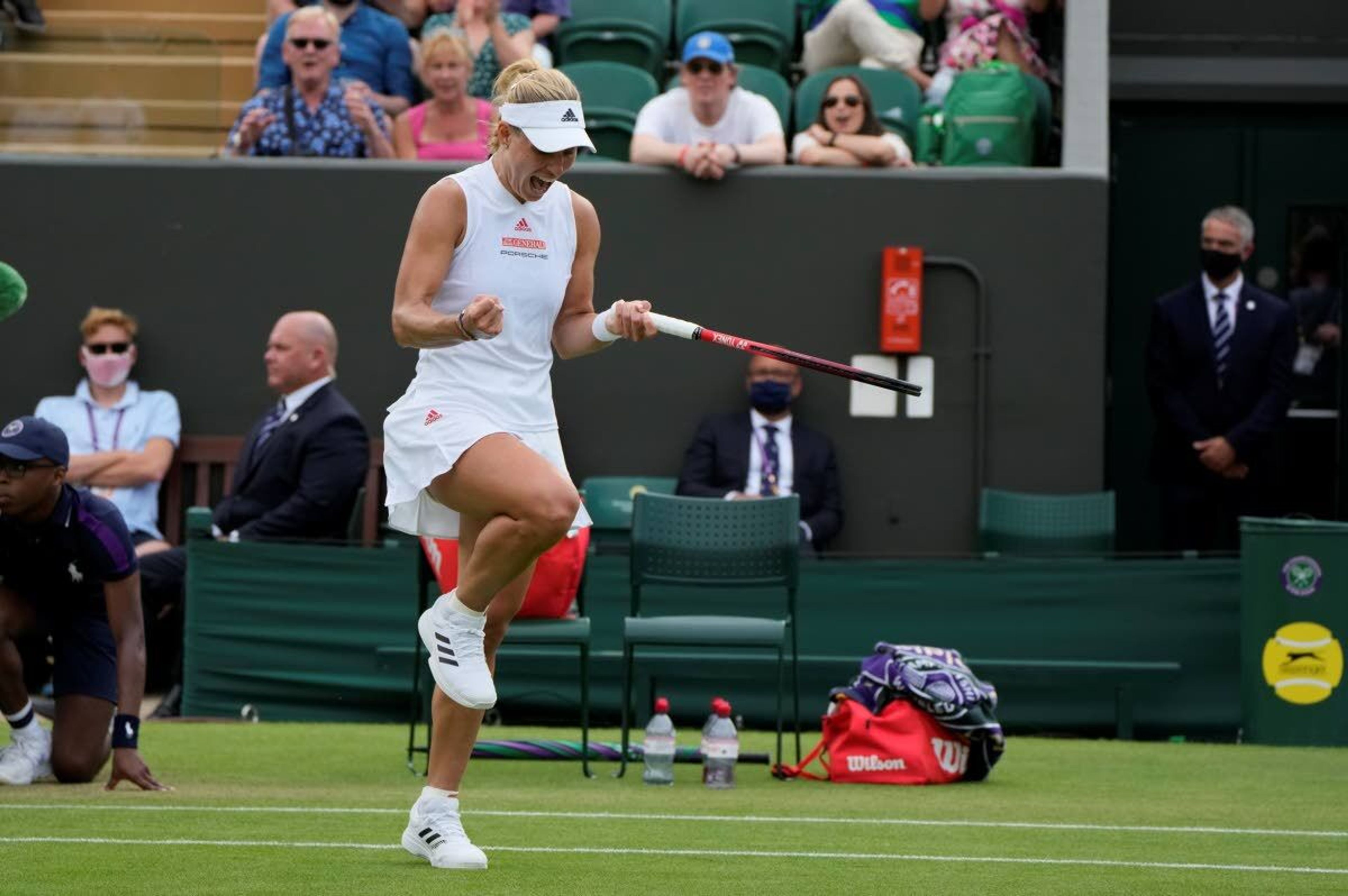 Germany's Angelique Kerber celebrates during the women's singles second round match against Spain's Sara Sorribes Tormo on day four of the Wimbledon Tennis Championships in London, Thursday July 1, 2021. (AP Photo/Alastair Grant)