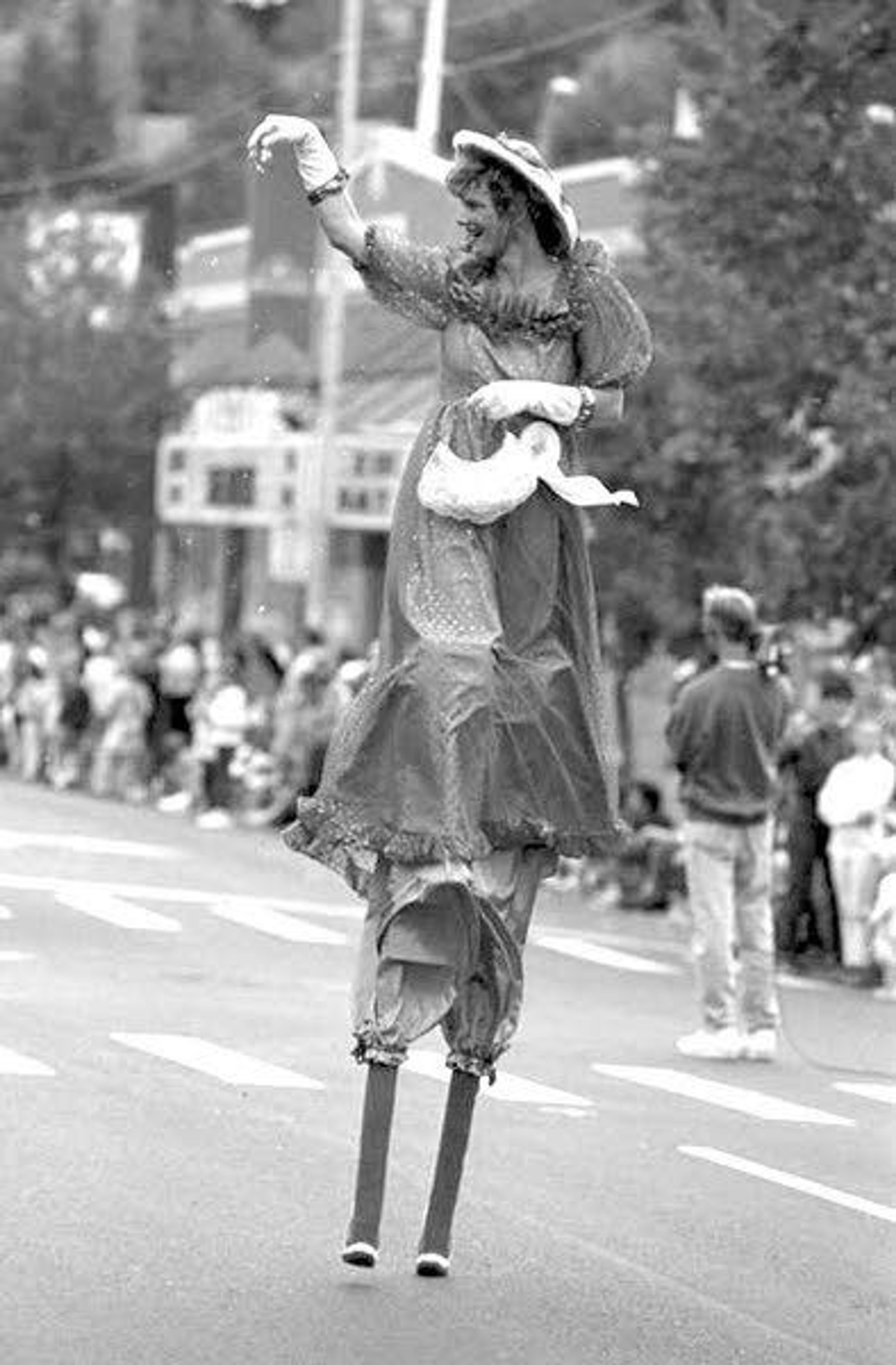 A woman participates in the National Lentil Festival Parade in downtown Pullman in 1992