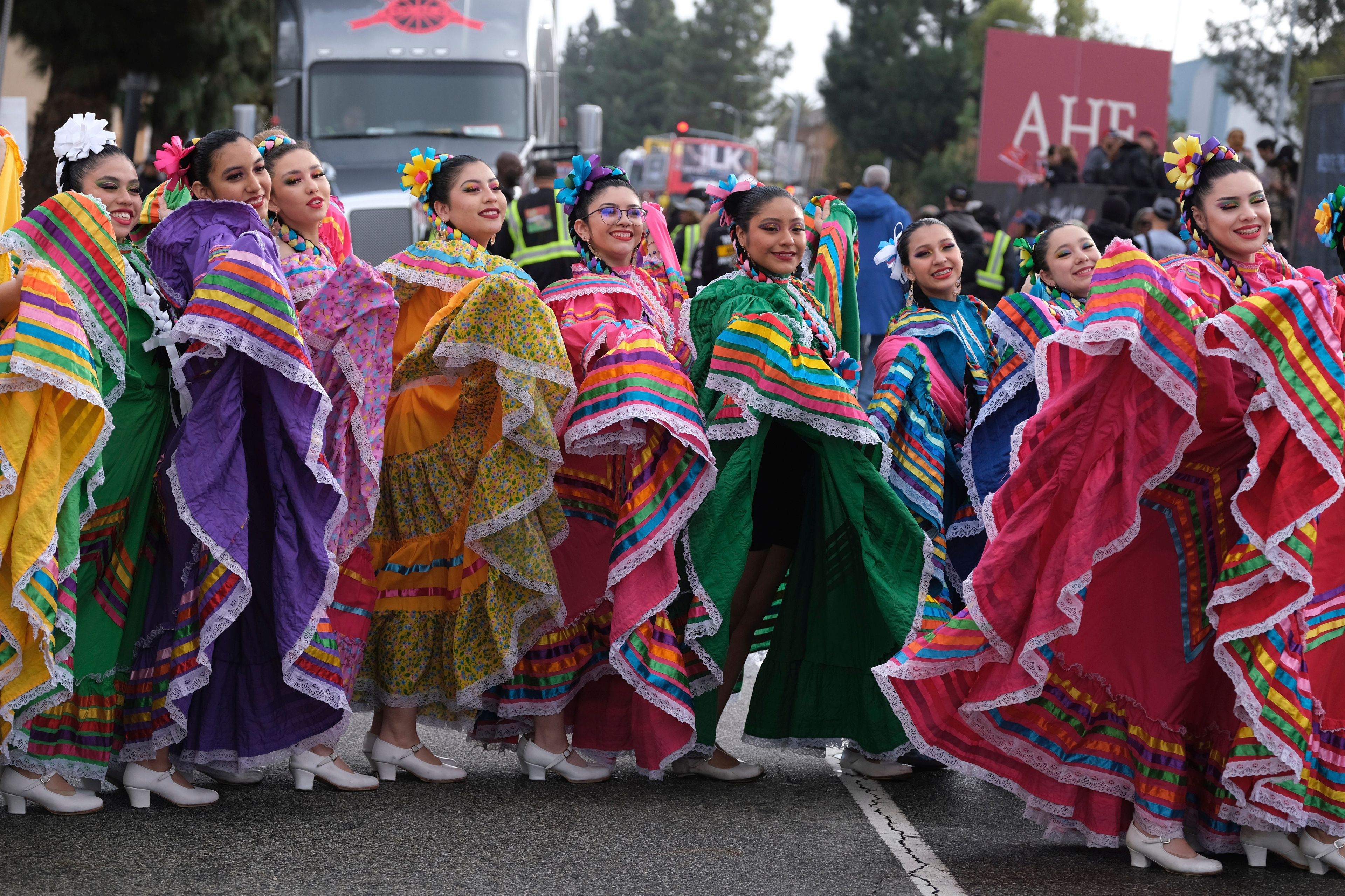 Members of the Cathedral City High School Ballet Folklorico pose for a photo prior to joining in the Kingdom Day Parade in Los Angeles, Monday, Jan. 16, 2023. After a two-year hiatus because of the COVID-19 pandemic, the parade, America's largest Martin Luther King Day celebration returned. (AP Photo/Richard Vogel)