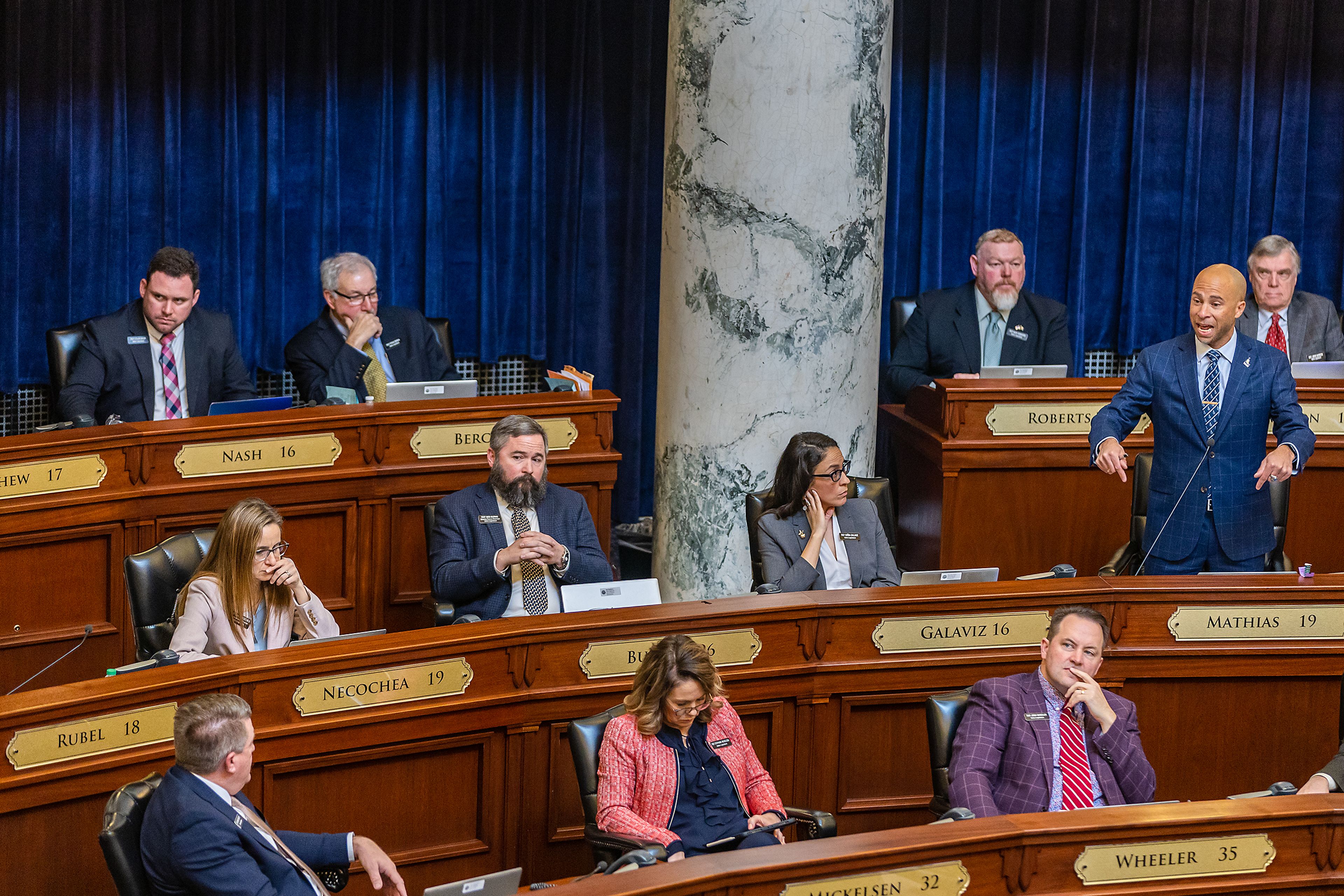 Representative Chris Mathias addresses the Idaho House of Representatives on Tuesday during a legislative session regarding a ban on transgender care for minors at the Capitol Building in Boise.