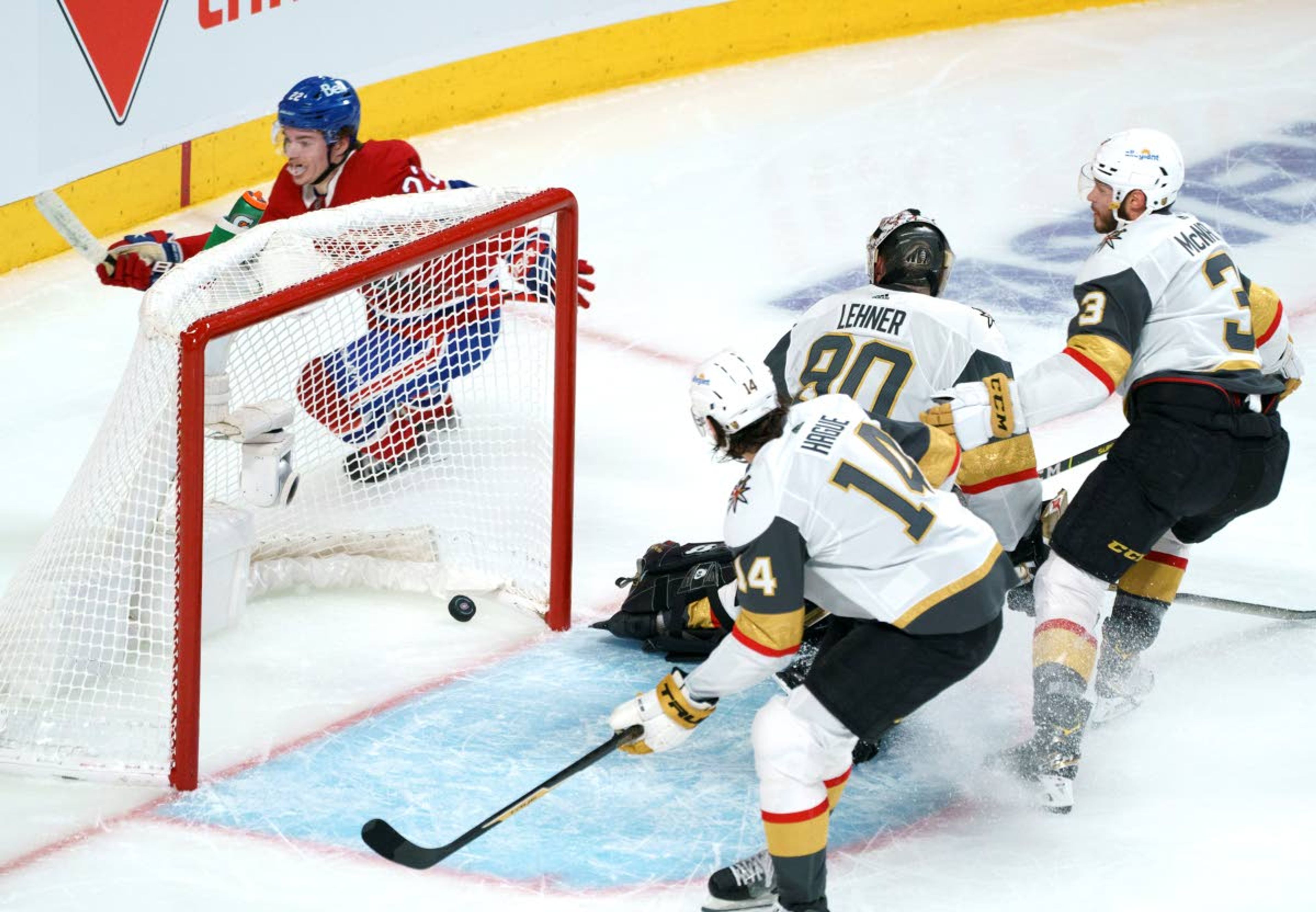 Montreal Canadiens' Cole Caufield (22) celebrates his goal past Vegas Golden Knights goaltender Robin Lehner as teammates Nicolas Hague (14) and Brayden McNabb (3) look on during the second period in Game 6 of an NHL hockey Stanley Cup semifinal playoff series Thursday, June 24, 2021 in Montreal. (Paul Chiasson/The Canadian Press via AP)