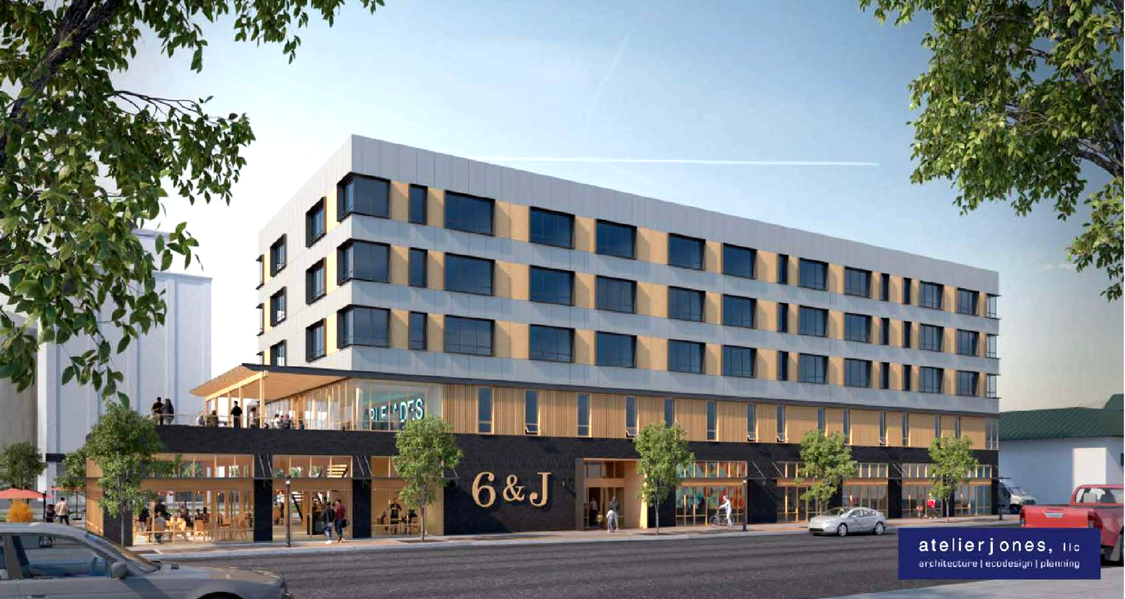 A digital rendering shows a proposed mixed-use building at sixth and Jackson in Moscow. The property will include a restaurant, retail spaces, offices and apartments.