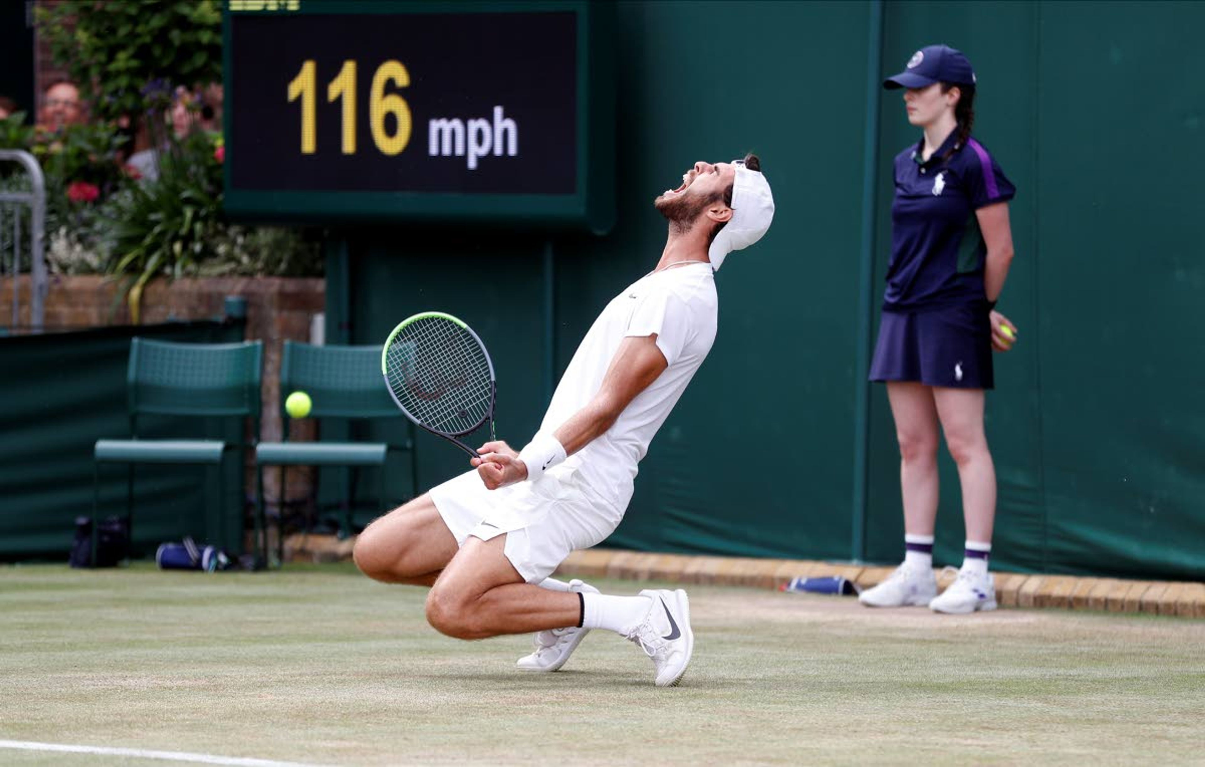 Sebastian Korda of the US plays a return during the men's singles fourth round match against Russia's Karen Khachanov on day seven of the Wimbledon Tennis Championships in London, Monday, July 5, 2021. (Peter Nicholls/Pool via AP)