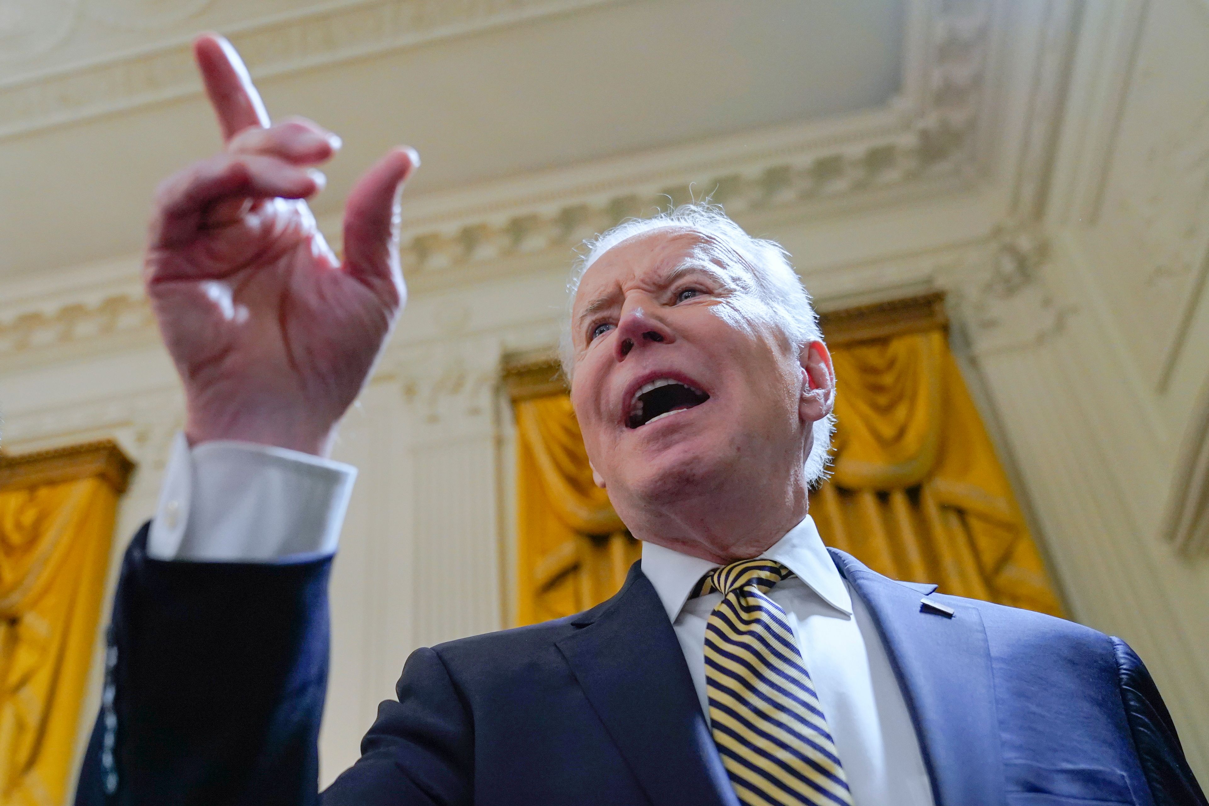 President Joe Biden responds to a question about Russian President Vladimir Putin in the East Room of the White House, Wednesday, March 16, 2022, in Washington. “He’s a war criminal,” Biden said as he left the event to mark the reauthorization of the Violence Against Women Act. (AP Photo/Patrick Semansky)