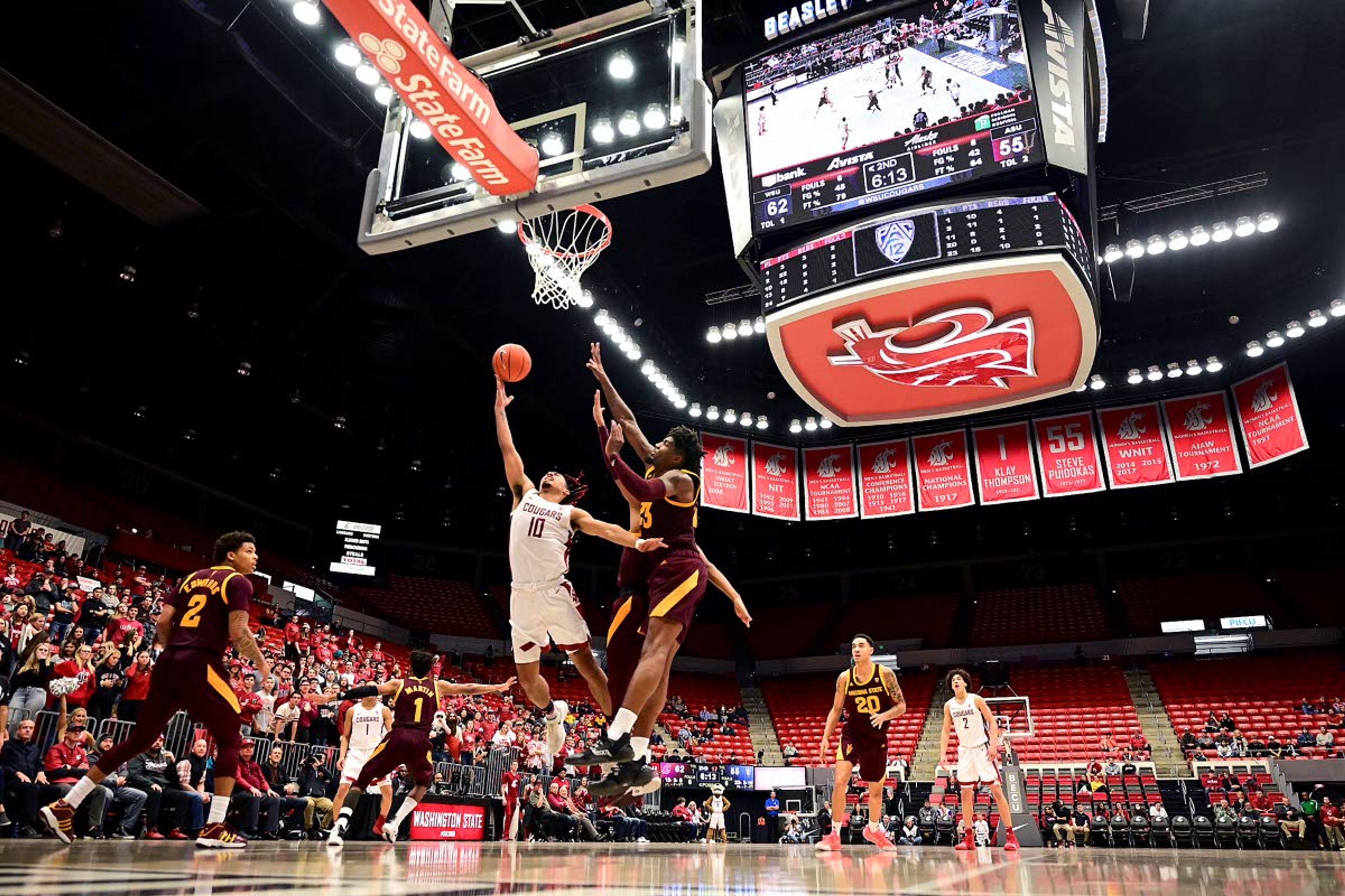 Washington State guard Isaac Bonton (10) attempts a shot as Arizona State forward Romello White (23) and guard Alonzo Verge Jr. (11) defend during the second half of a Pac-12 Conference basketball game on Wednesday night at Beasley Coliseum in Pullman.