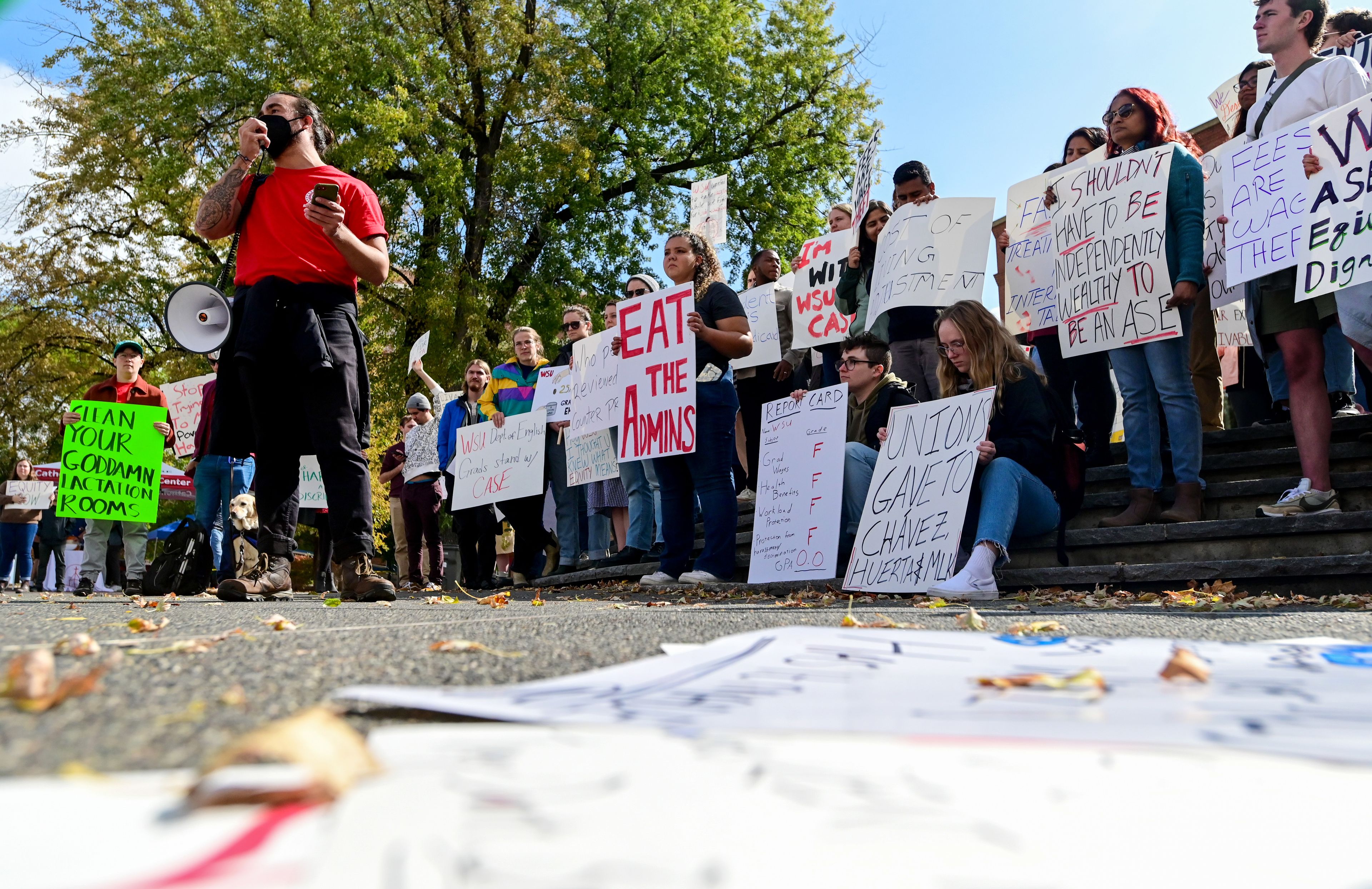 Gavin Doyle, left, a third-year PhD student in rhetoric and composition studies at Washington State University, speaks at a rally supporting contract negotiations for Academic Student Employees at Glenn Terrell Mall on Wednesday in Pullman.