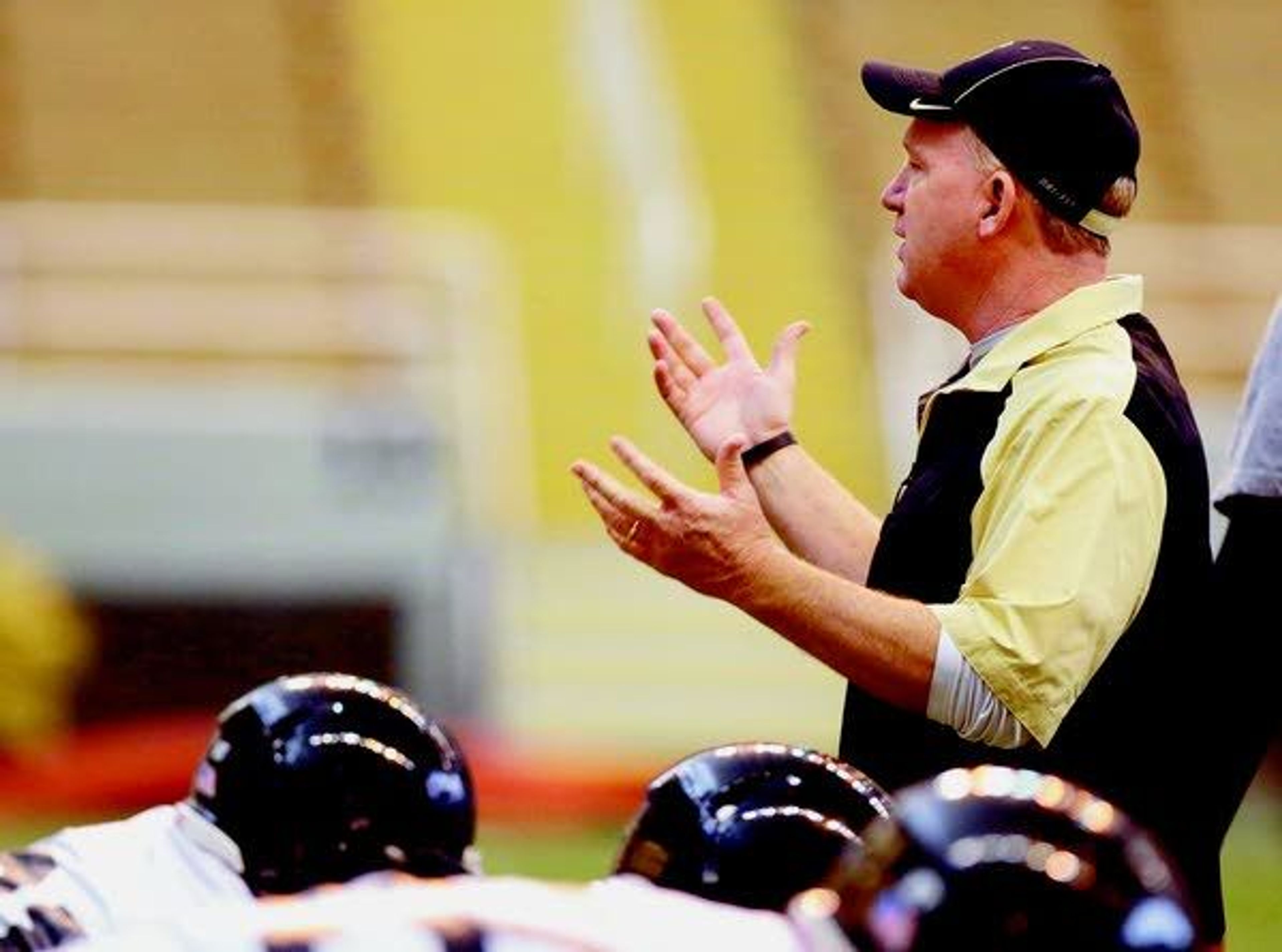 Idaho football coach Paul Petrino gestures during a March 25 spring practice at the Kibbie Dome in Moscow. The Vandals begin fall camp Wednesday.