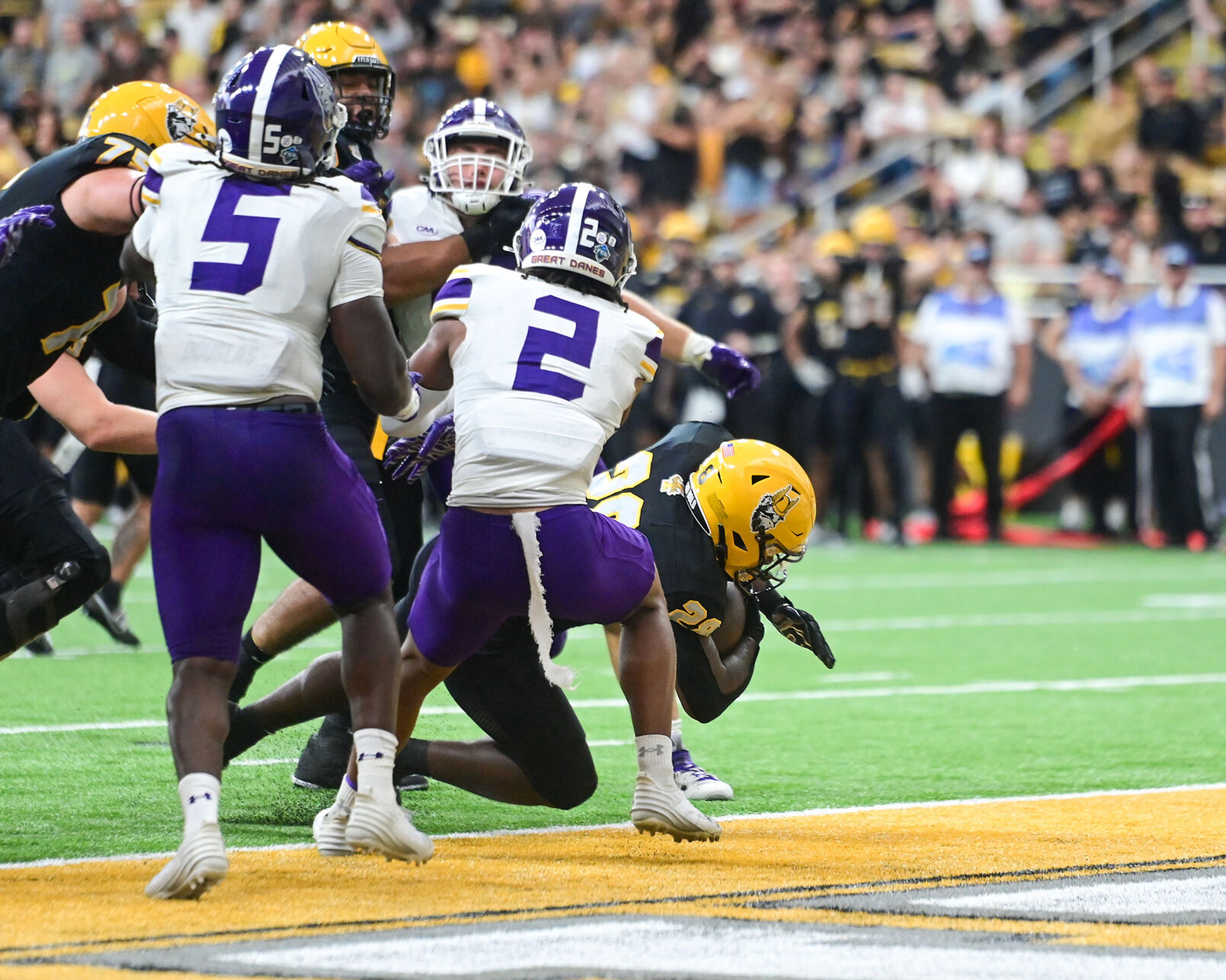 Idaho Vandals running back Nate Thomas (28) dives into the end zone for a touchdown against the Albany Great Danes Saturday at the P1FCU Kibbie Dome in Moscow.