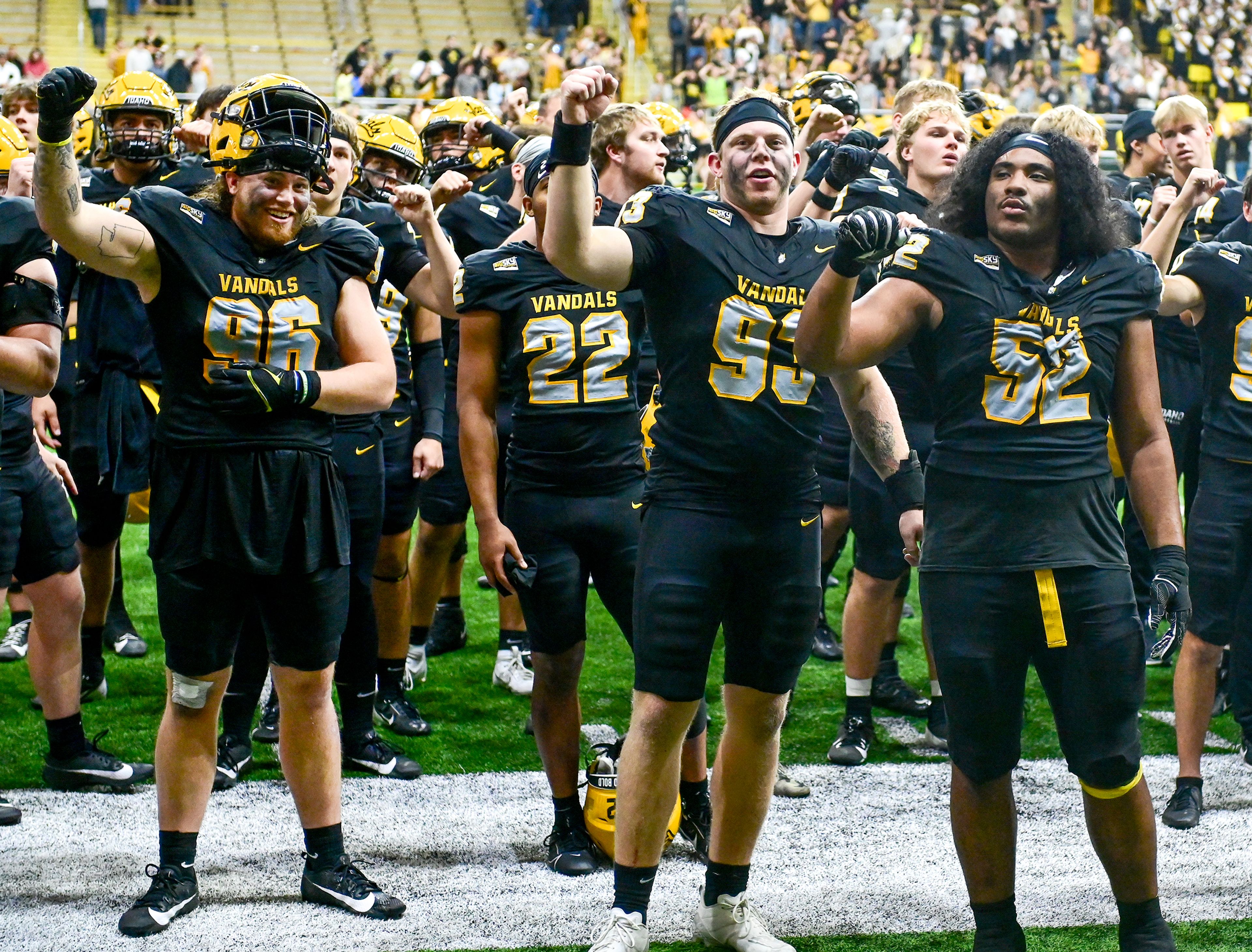 Idaho players sing along to a school song after their win over Cal Poly Saturday at the P1FCU Kibbie Dome in Moscow.,