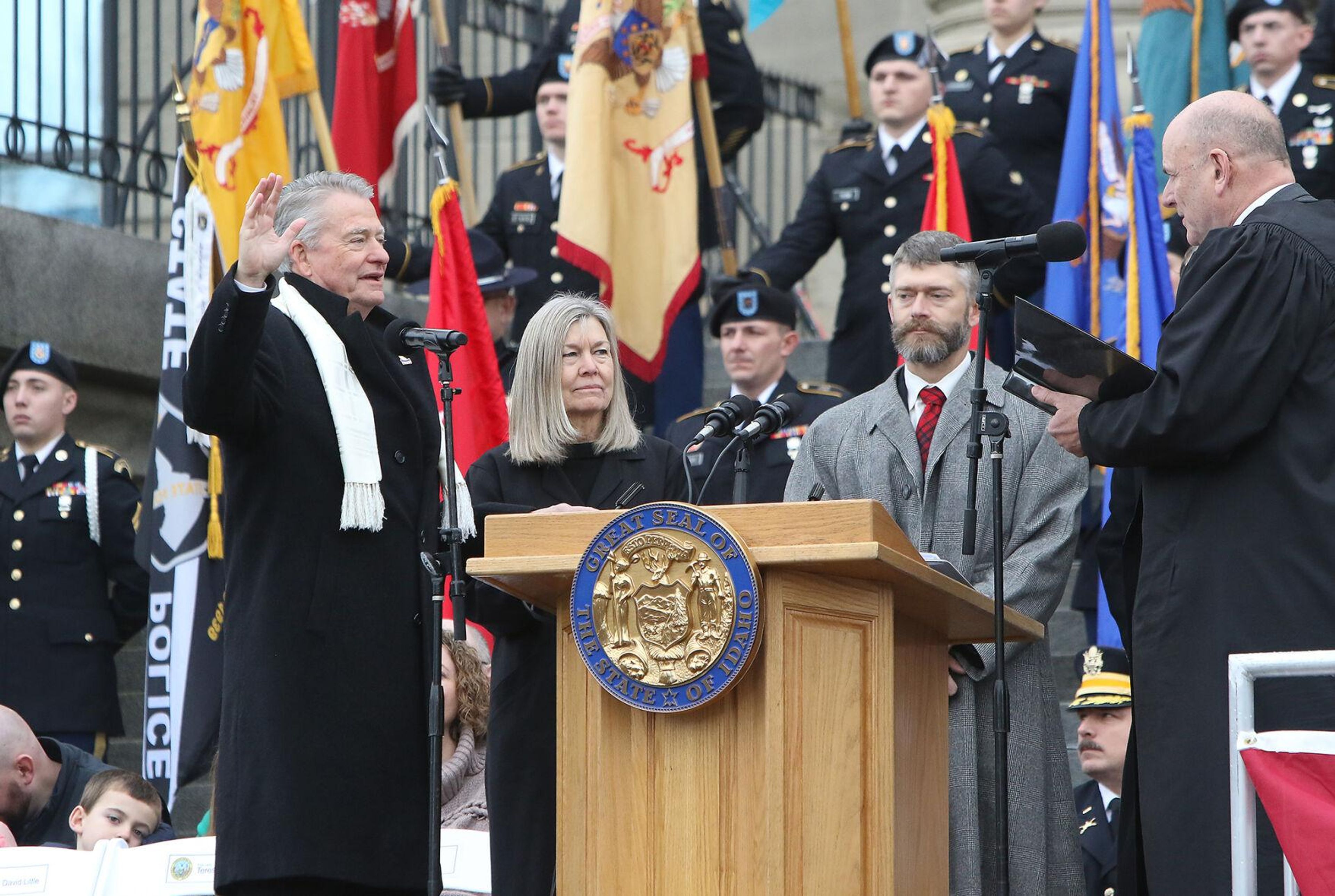 Gov. Brad Little takes the oath of office, administered by Chief Justice G. Richard Bevan, during an inauguration ceremony in front of the Idaho State Capitol on Friday.