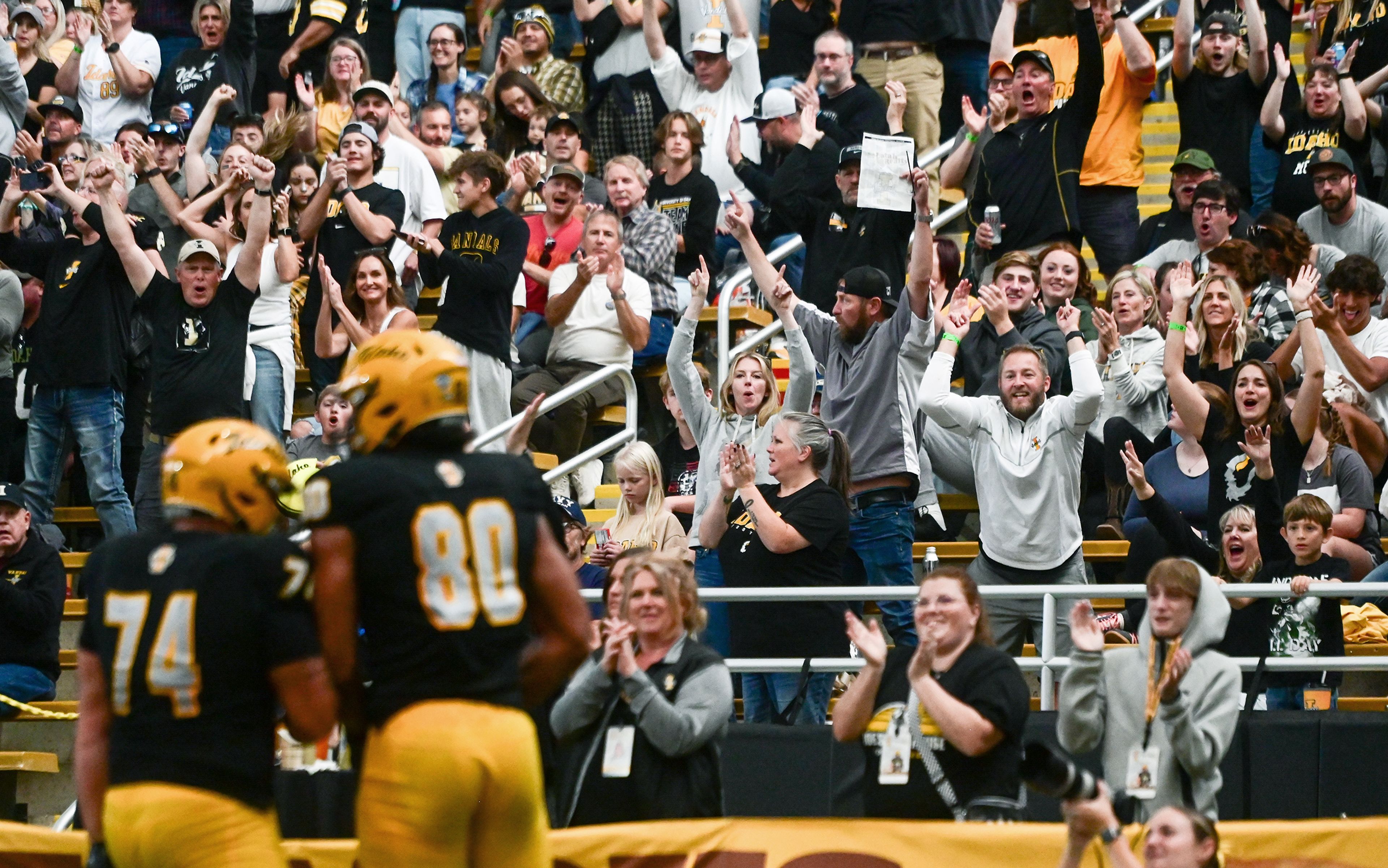 Fans cheer for a touchdown by Idaho tight end Mike Martinez during a game against Northern Arizona Saturday at the P1FCU Kibbie Dome in Moscow.,