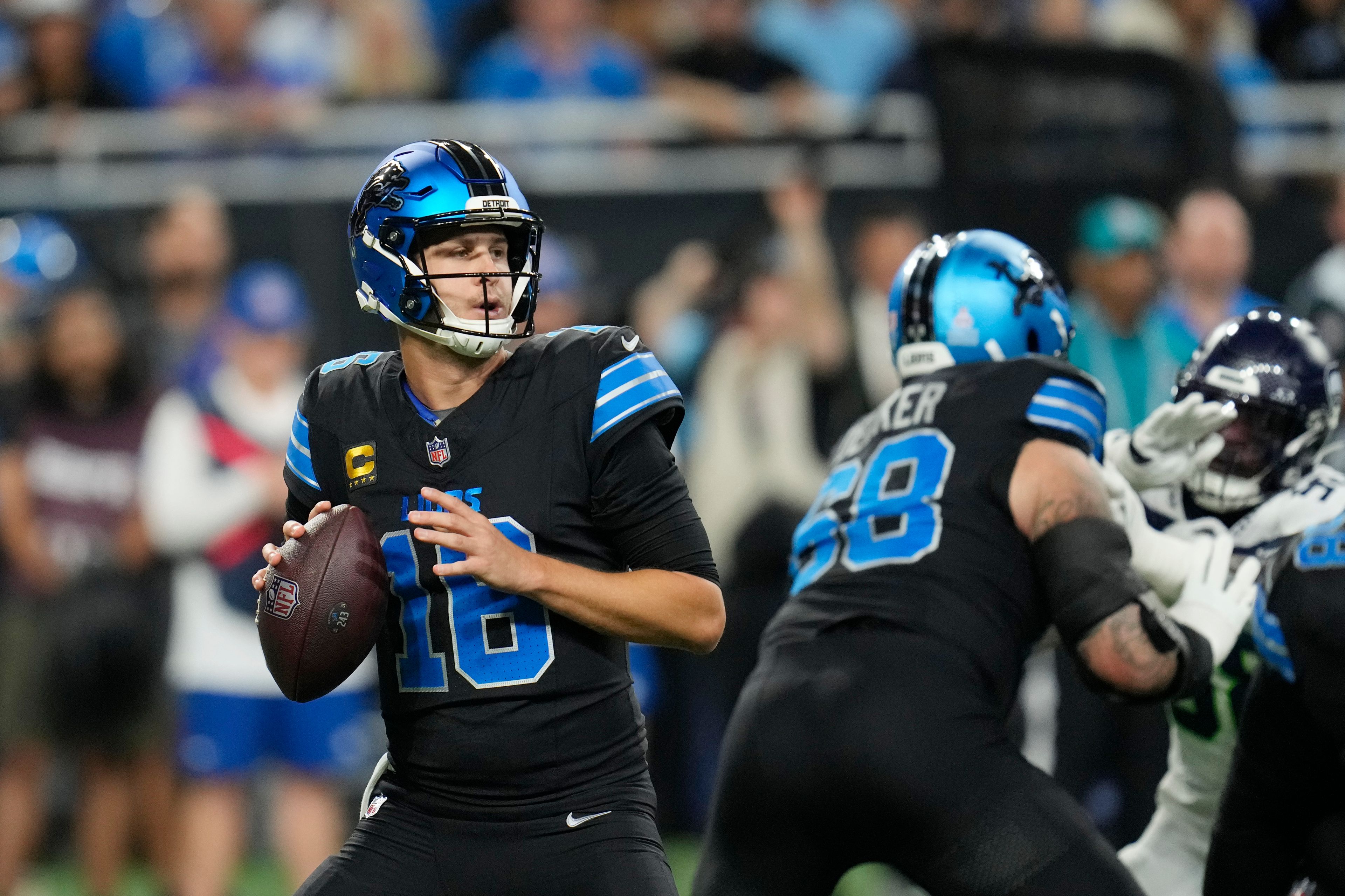 Detroit Lions quarterback Jared Goff looks to pass during the first half of an NFL football game against the Seattle Seahawks, Monday, Sept. 30, 2024, in Detroit. (AP Photo/Paul Sancya)