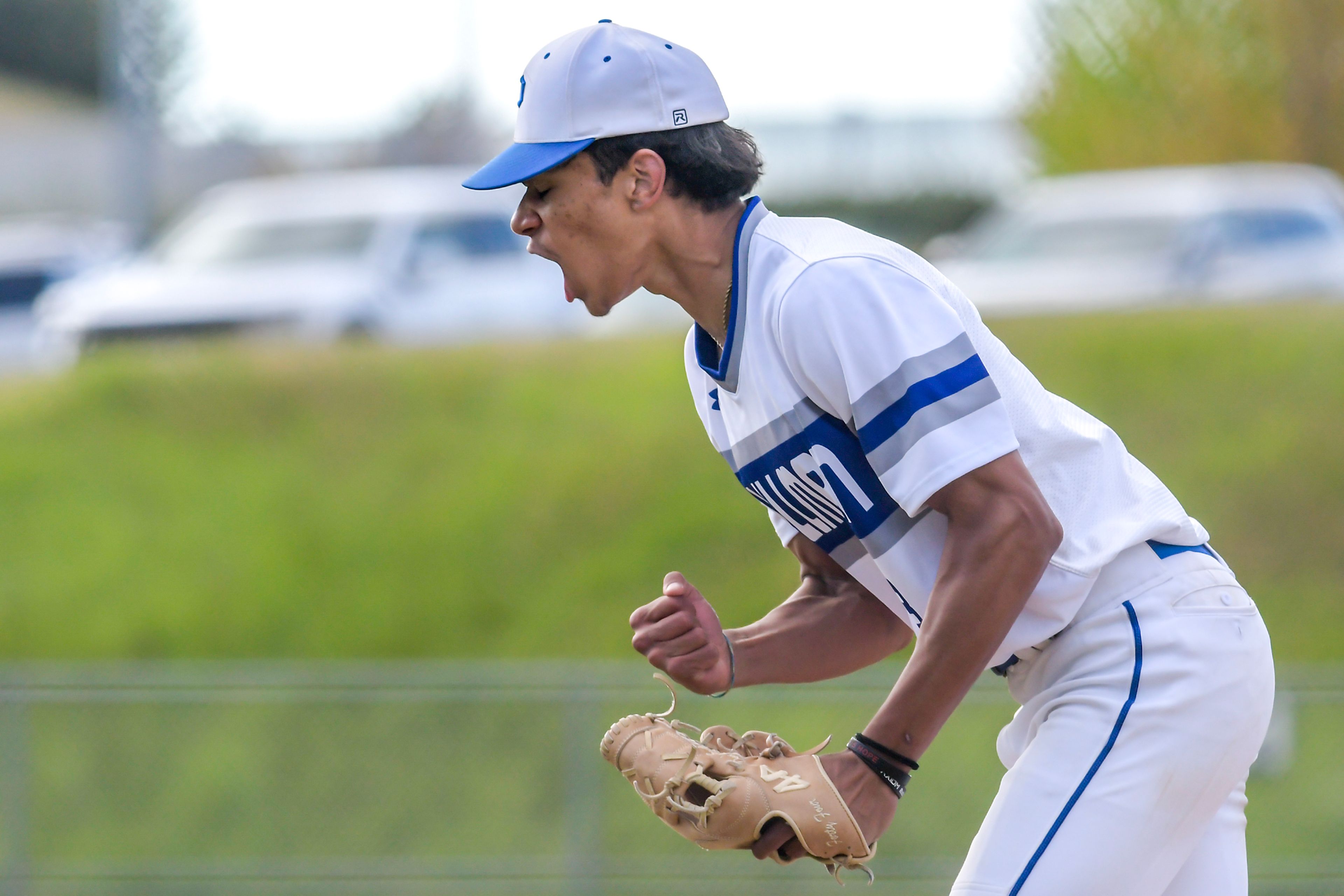 Pullman pitcher Caleb Northcroft lets out a yell after ending an inning against Clarkston in a semifinal game of a Washington Class 2A district tournament in Pullman.