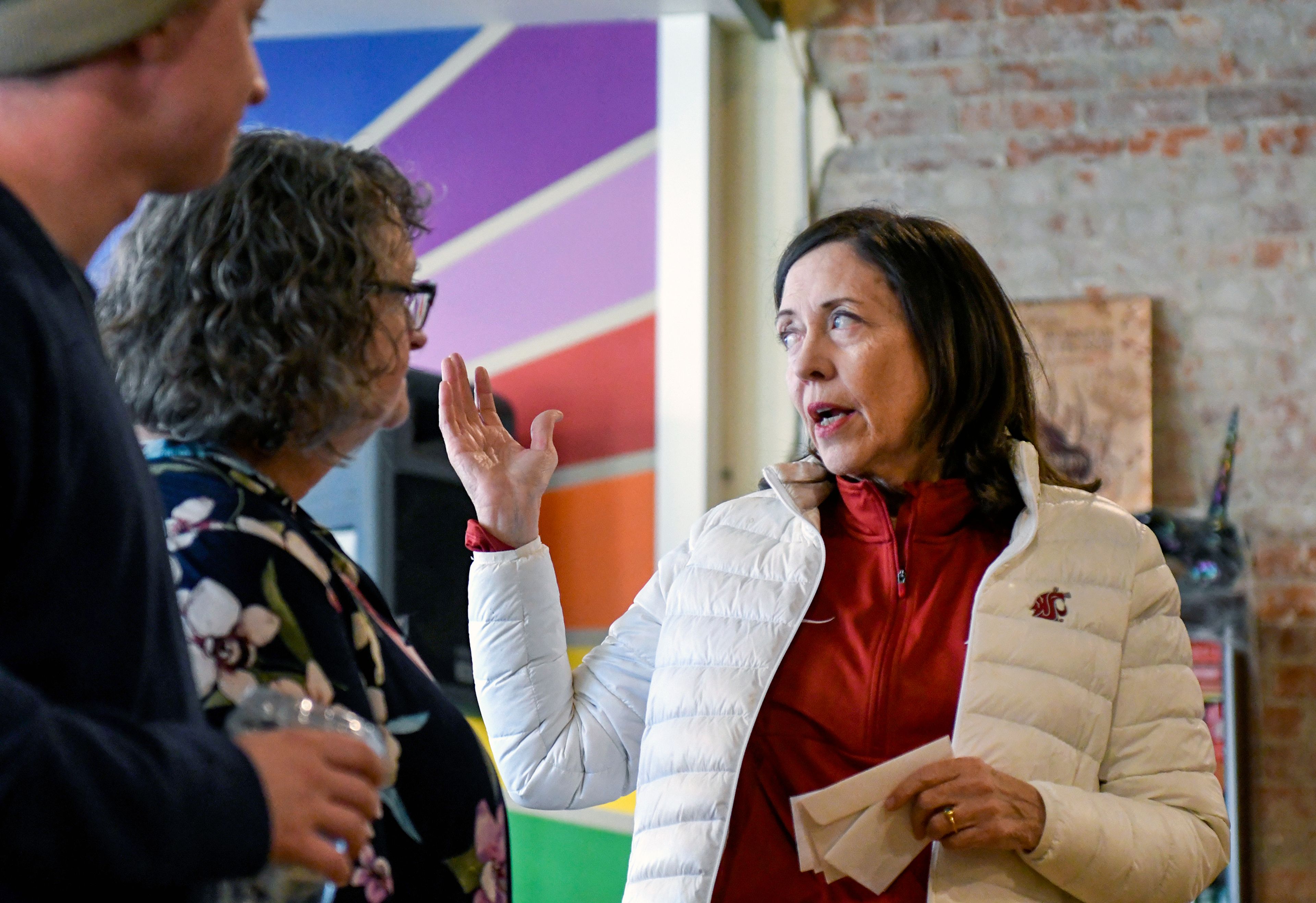 U.S. Sen. Maria Cantwell, right, kicks off a phone banking and canvassing event with Whitman County Democrats team members and supporters Thursday at Pups and Cups Cafe in Pullman.