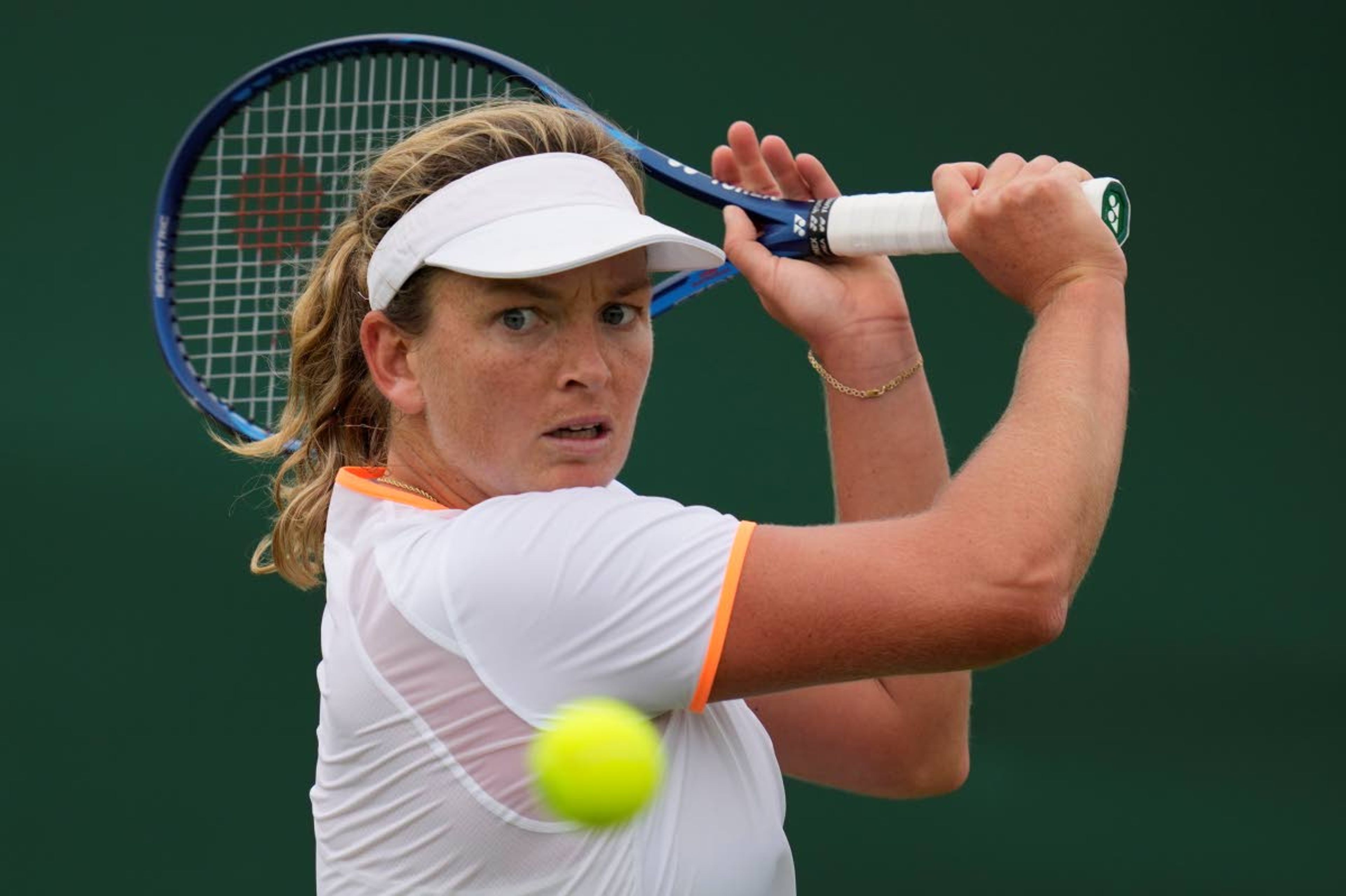 Coco Vandeweghe of the US plays a return to Belarus's Olga Govortsova during the women's singles first round match on day three of the Wimbledon Tennis Championships in London, Wednesday June 30, 2021. (AP Photo/Kirsty Wigglesworth)