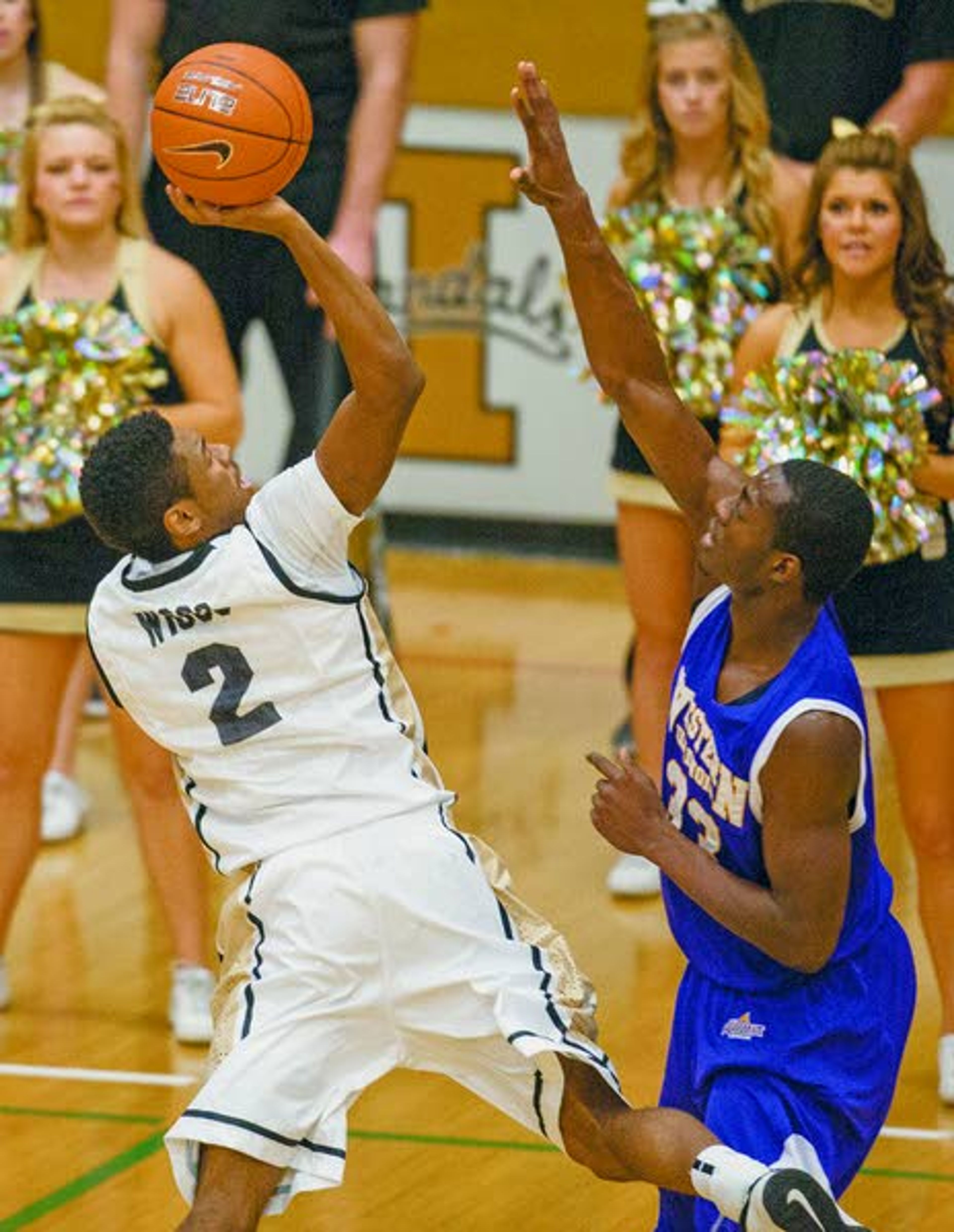 Idaho guard Sekou Wiggs (2) draws a foul as he shoots over Western Illinois forward Adam Link, right, during the first half of Saturday’s game at Memorial Gym. in Moscow, Idaho. (AP Photo/Moscow-Pullman Daily News, Dean Hare)