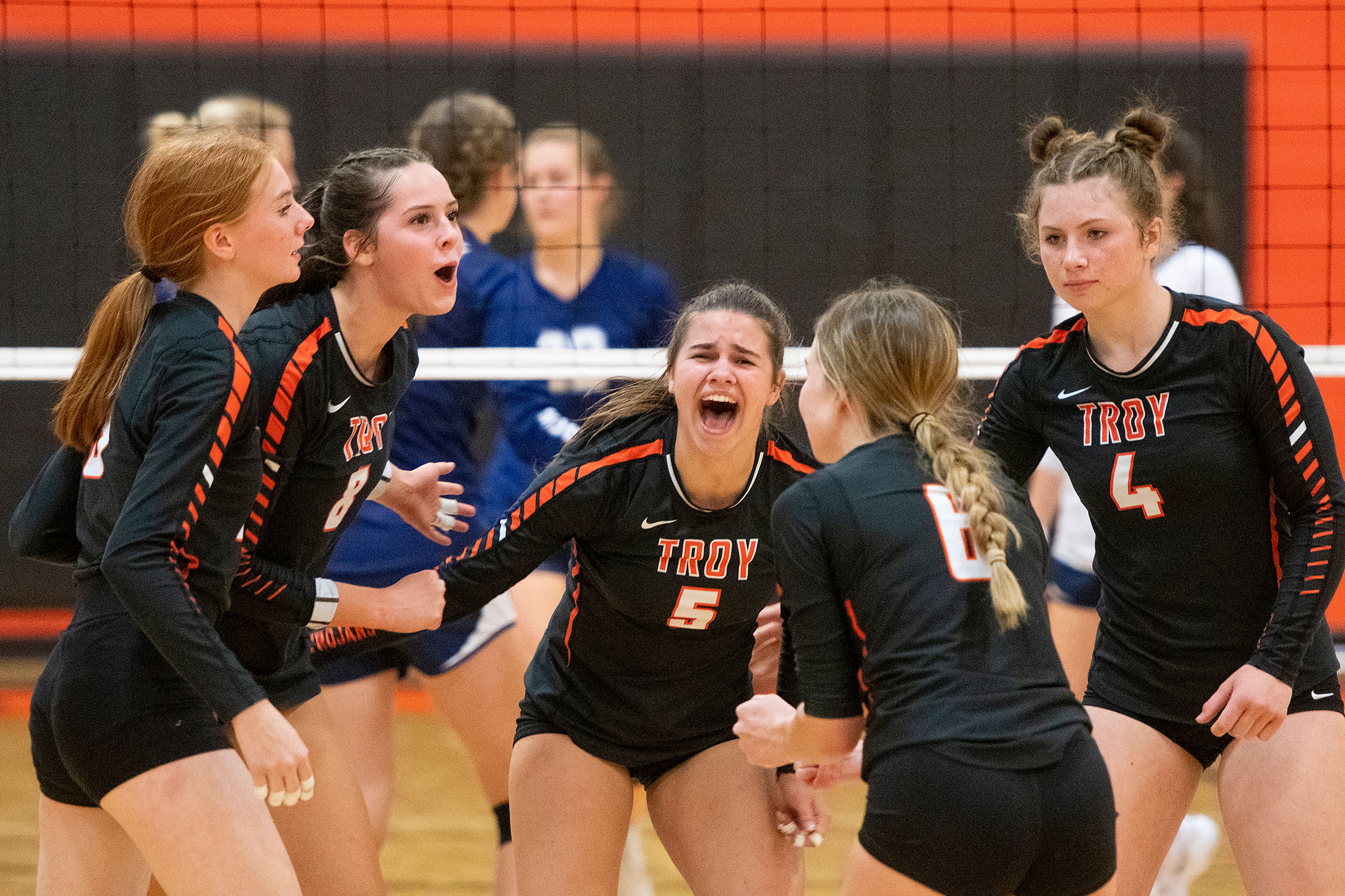 Troy players celebrate after scoring against Logos during a Whitepine League matchup Sept. 20 at Troy High School. The Trojans over the weekend won their third Idaho Class 1A Division I state title in the past five years.