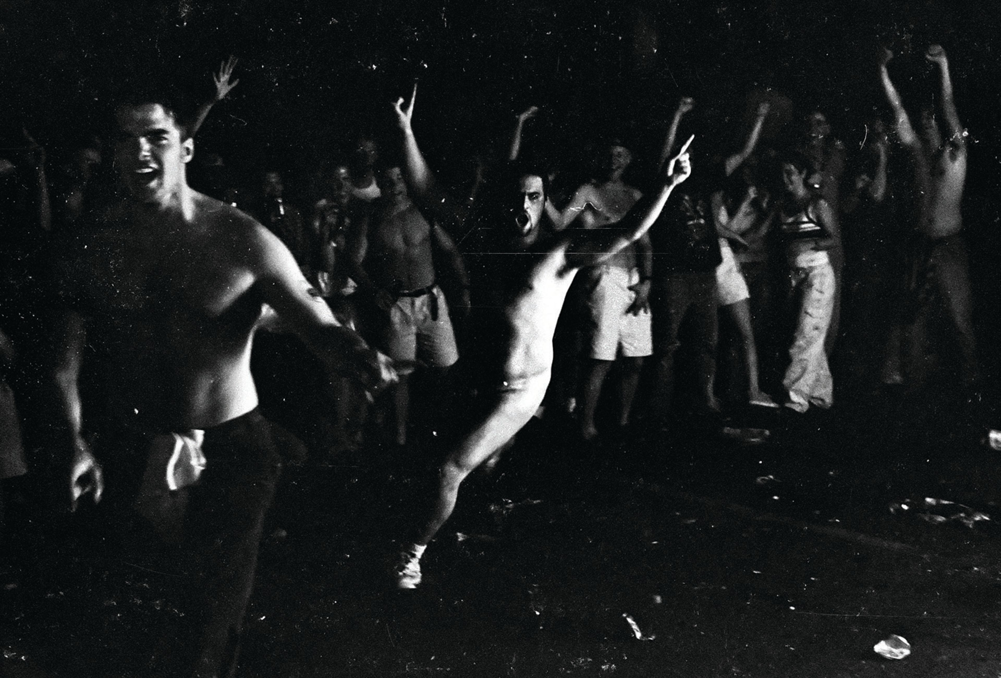 Partygoers cheer as a riot breaks out on College Hill in Pullman.