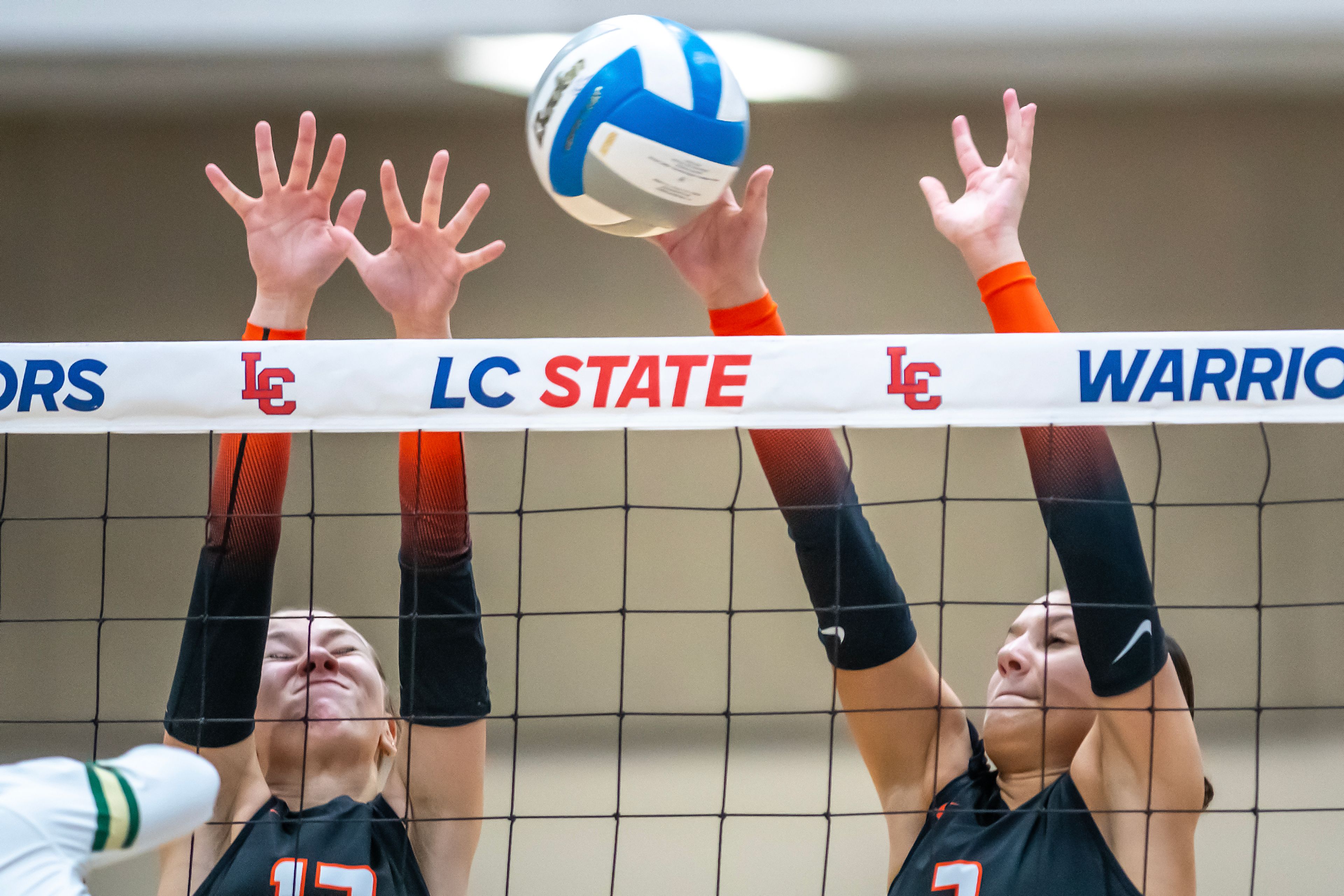 Troy Middle blocker Paige Foote, left, and outside hitter Teagan Gale leap up to block a Potlatch spike during a 2A district championship Wednesday at the P1FCU Activity Center in Lewiston.