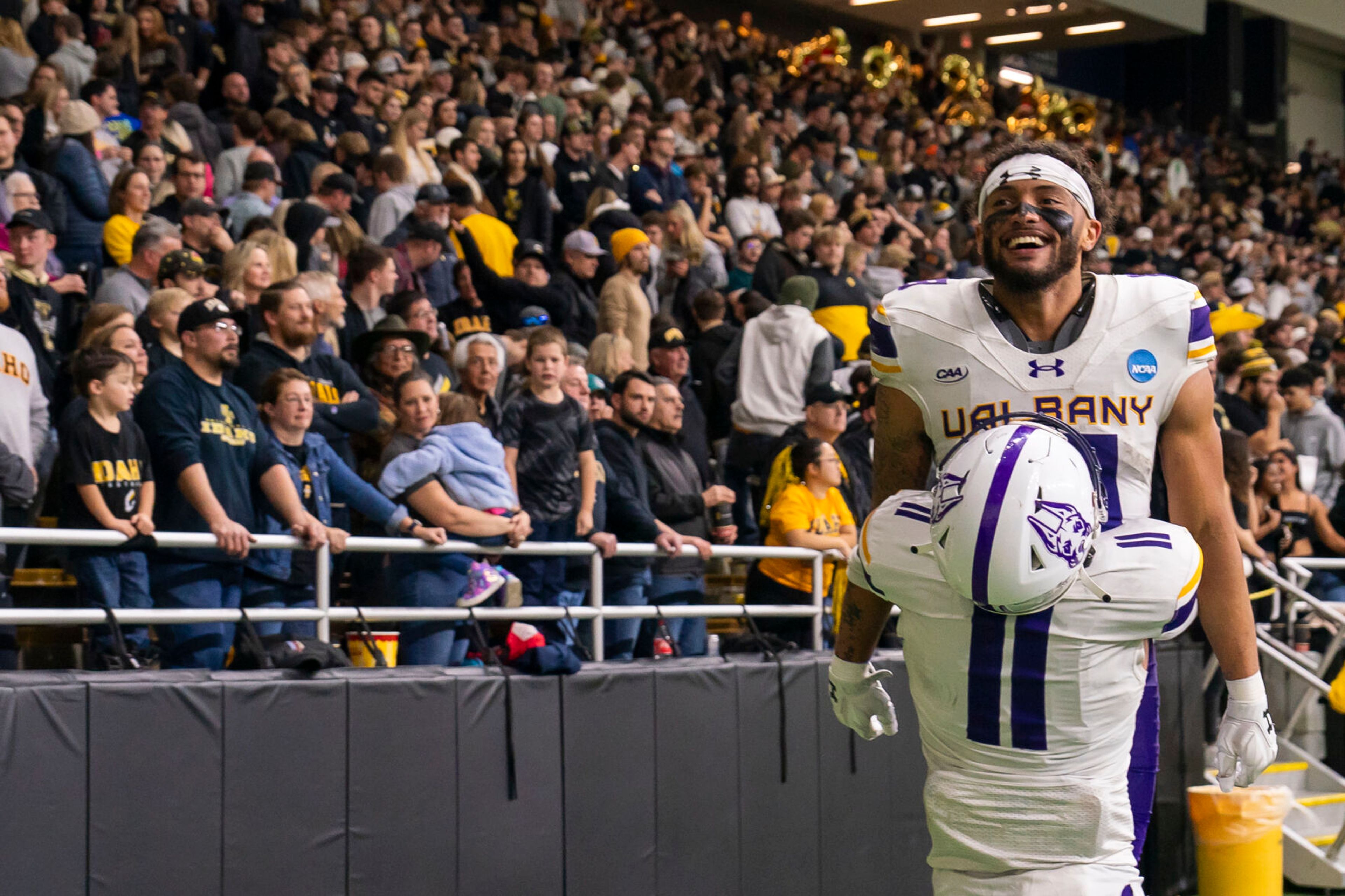 Albany Great Danes wide receiver Brevin Easton (13) is lifted into the air by wide receiver Caden Burti (11) as after they won a Football Championship Subdivision playoffs game against Idaho on Dec. 9, 2023, in Moscow.