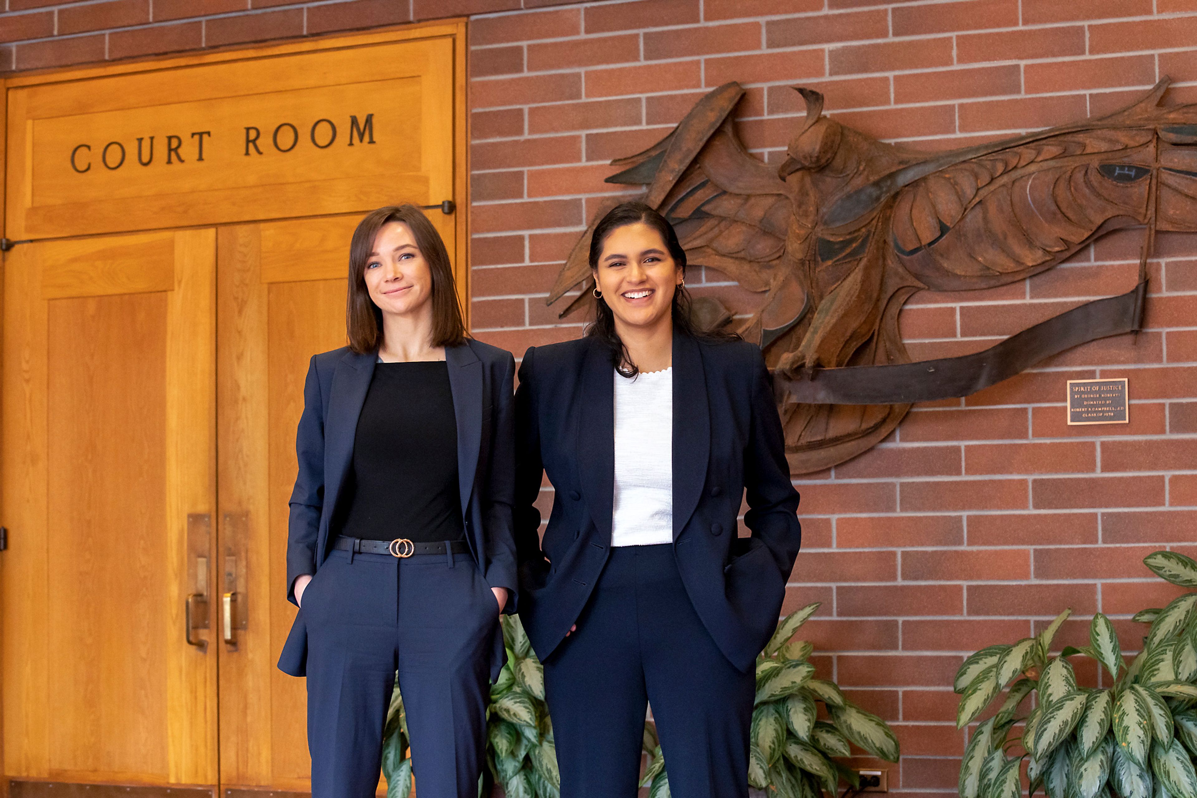 Rebecca Jensen, left, and Alejandra Cabrales stand outside the court room Wednesday in Moscow.