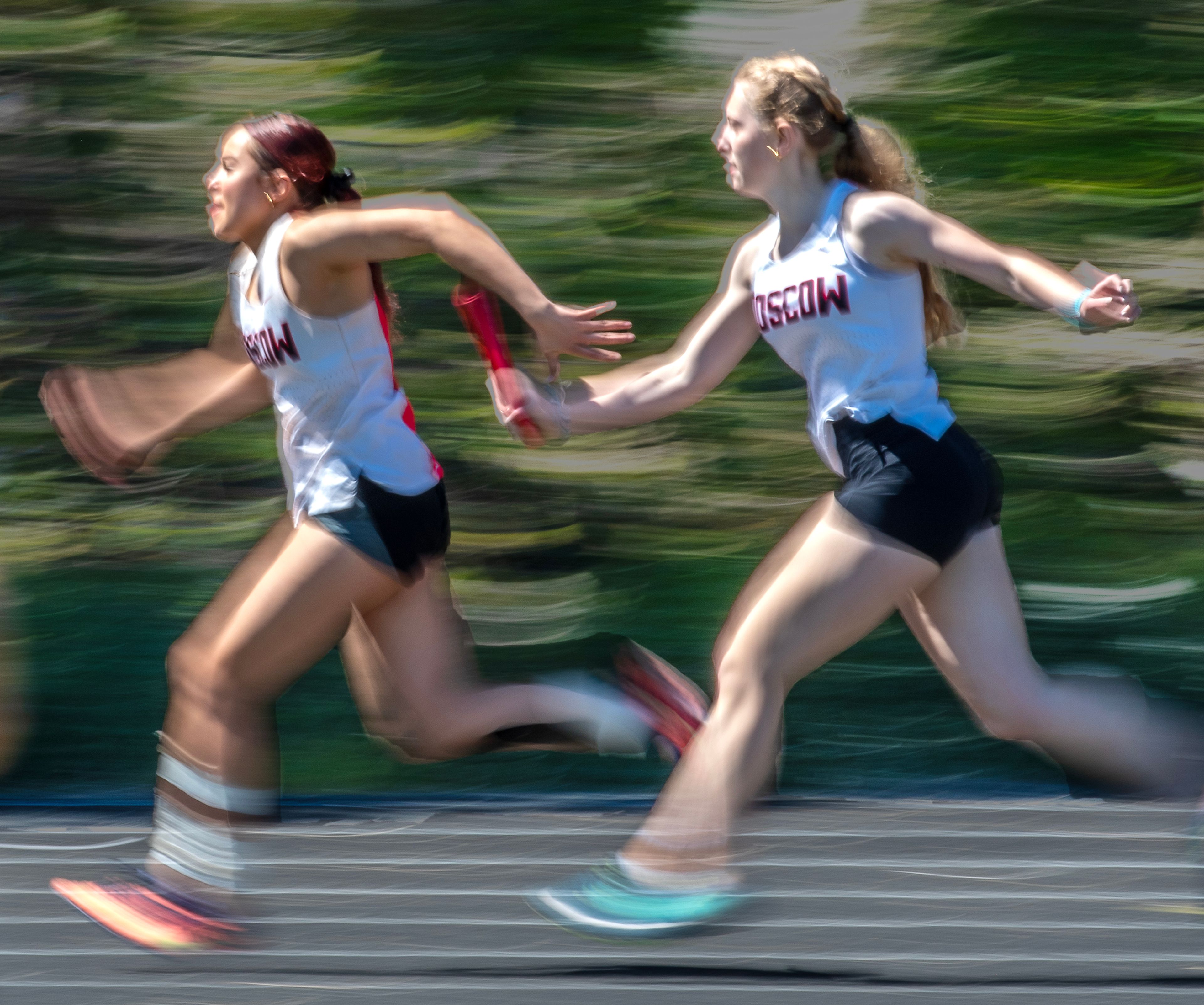 Moscow athletes hand off the baton in the 4x200 meter relay Thursday at the Meet of Champions at Sweeney Track and Vollmer Bowl in Lewiston.