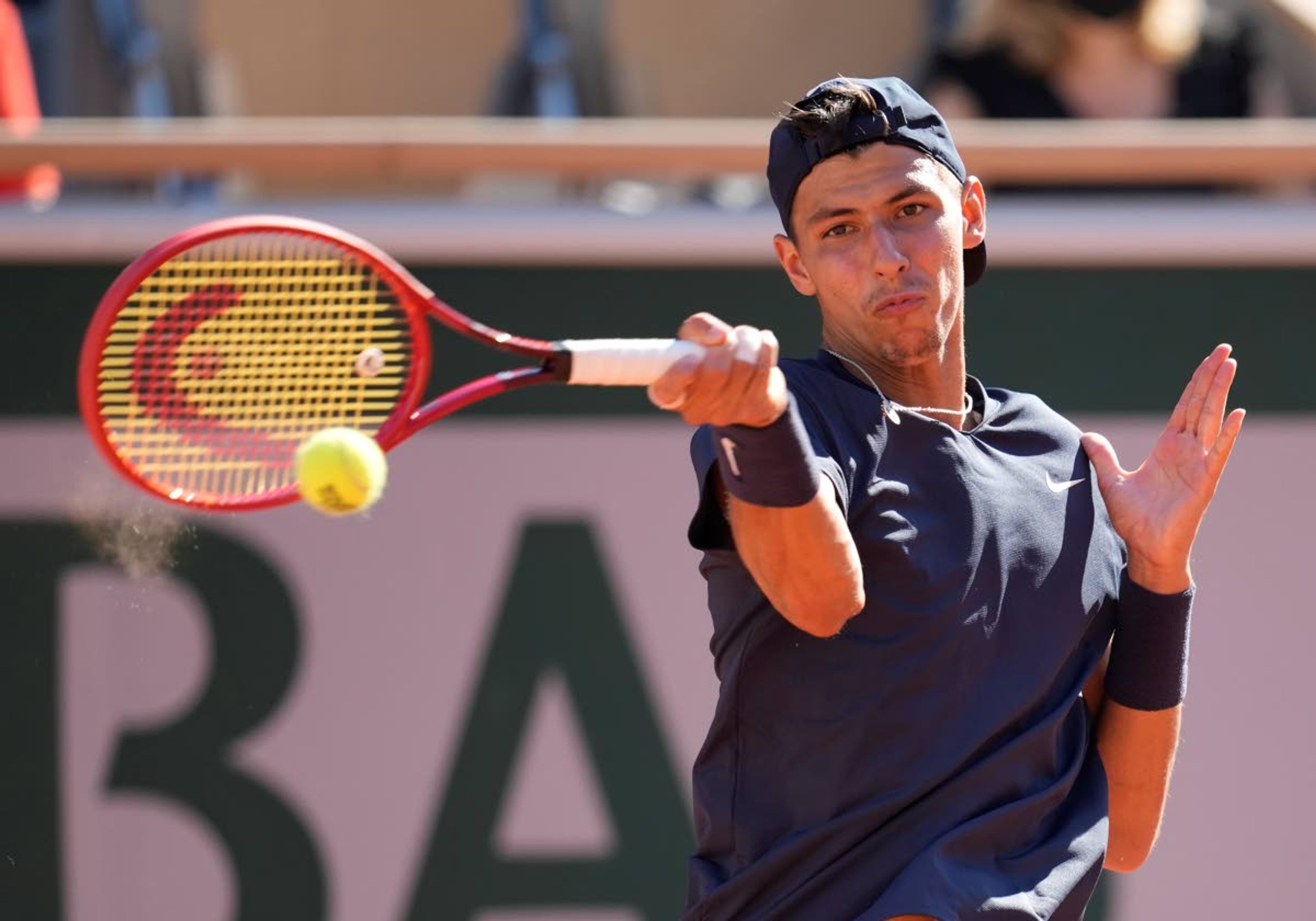 Australia's Alexei Popyrin plays a return to Spain's Rafael Nadal during their first round match on day three of the French Open tennis tournament at Roland Garros in Paris, France, Tuesday, June 1, 2021. (AP Photo/Christophe Ena)