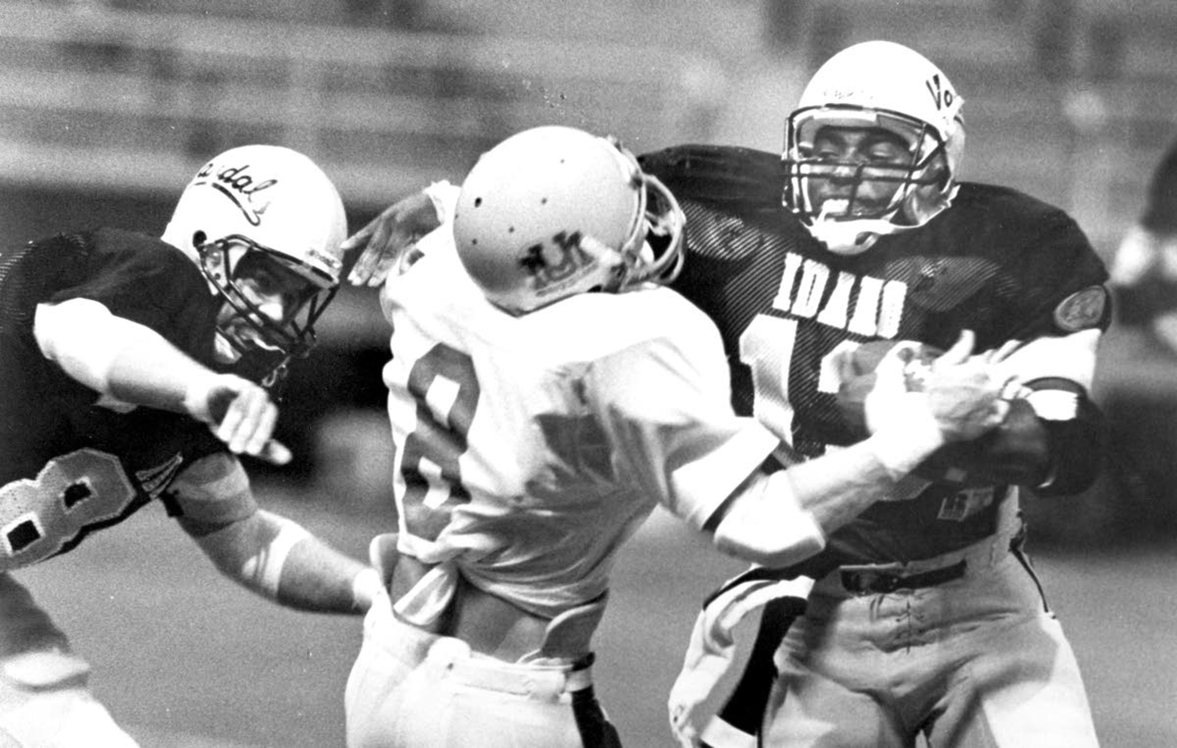 Idaho running back Larry Leverett (right) pushes aside Montana safety Nate Odden during a game in 1987 at the Kibbie Dome in Moscow. The Vandals won 31-25 to claim the Little Brown Stein for the sixth straight time.