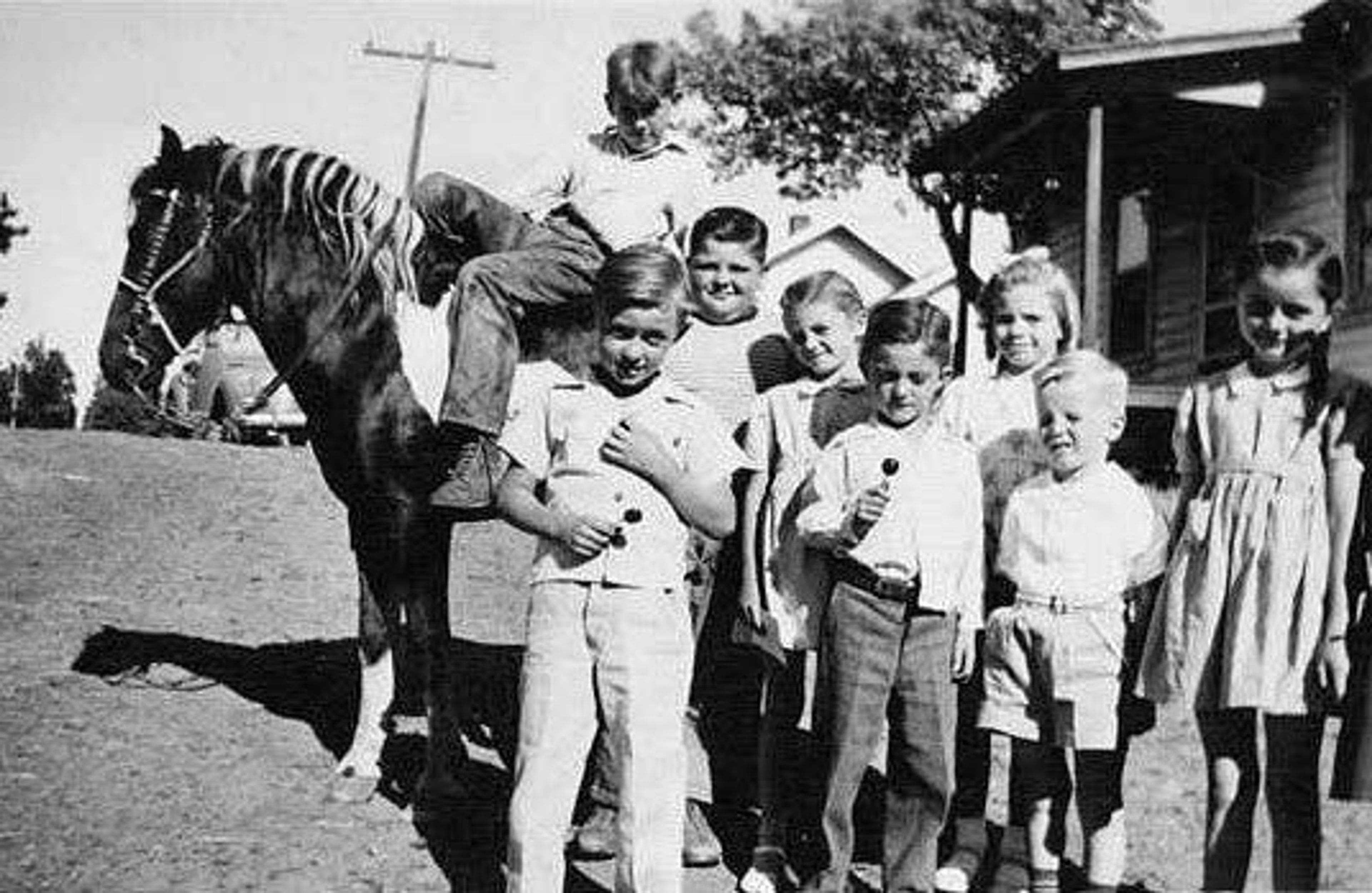 Children pose with a pony while attending story hour in 1945 at the Pine City Branch of the Whitman County Rural Library District.