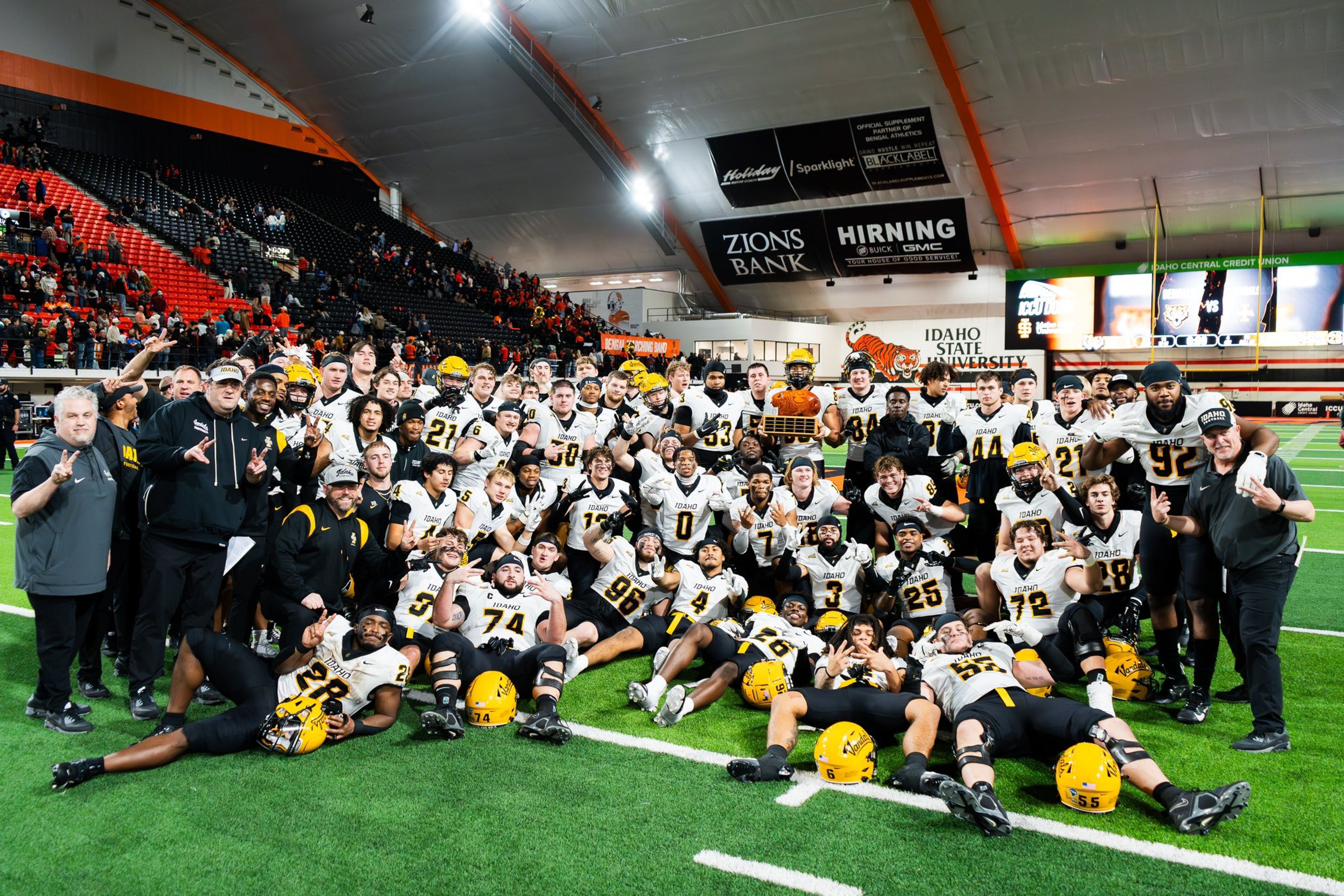 The Idaho football team poses with the “Potato State Trophy” after defeating Idaho State 40-17 on Saturday in Pocatello.