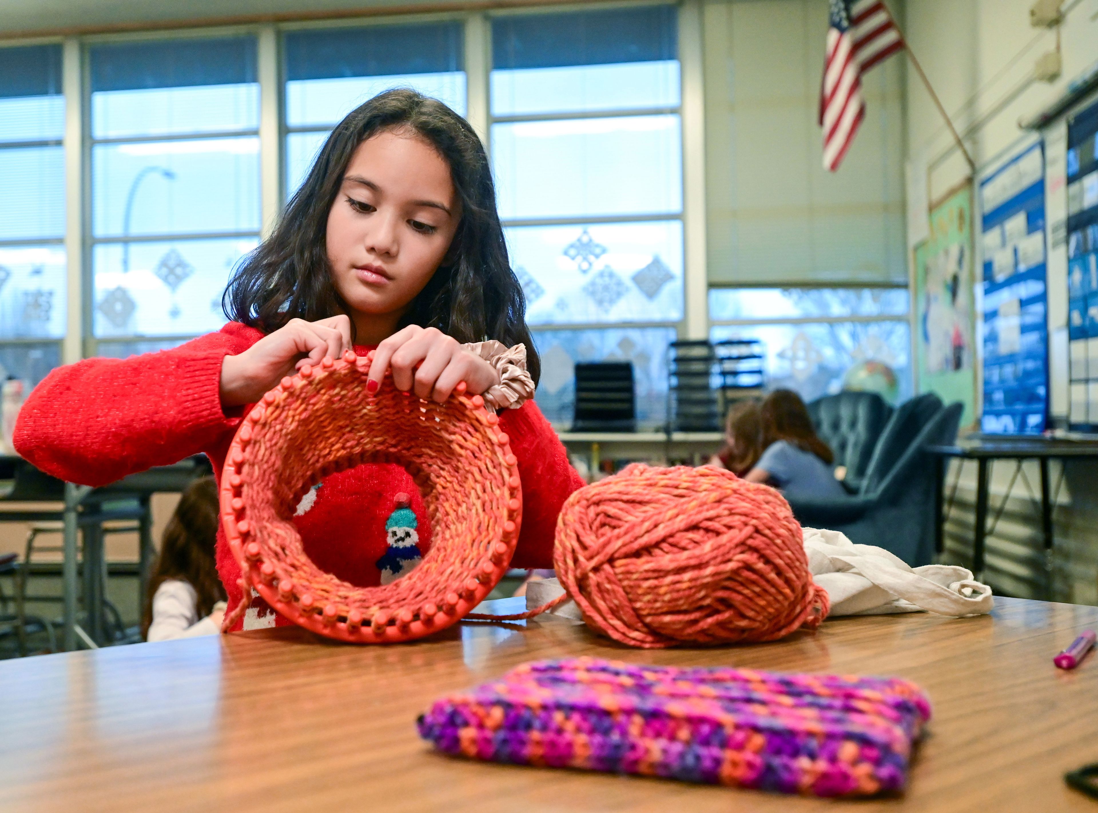 A hat takes shape in the loom of fourth-grader Olivia Hattenburg at Lena Whitmore Elementary School in Moscow.