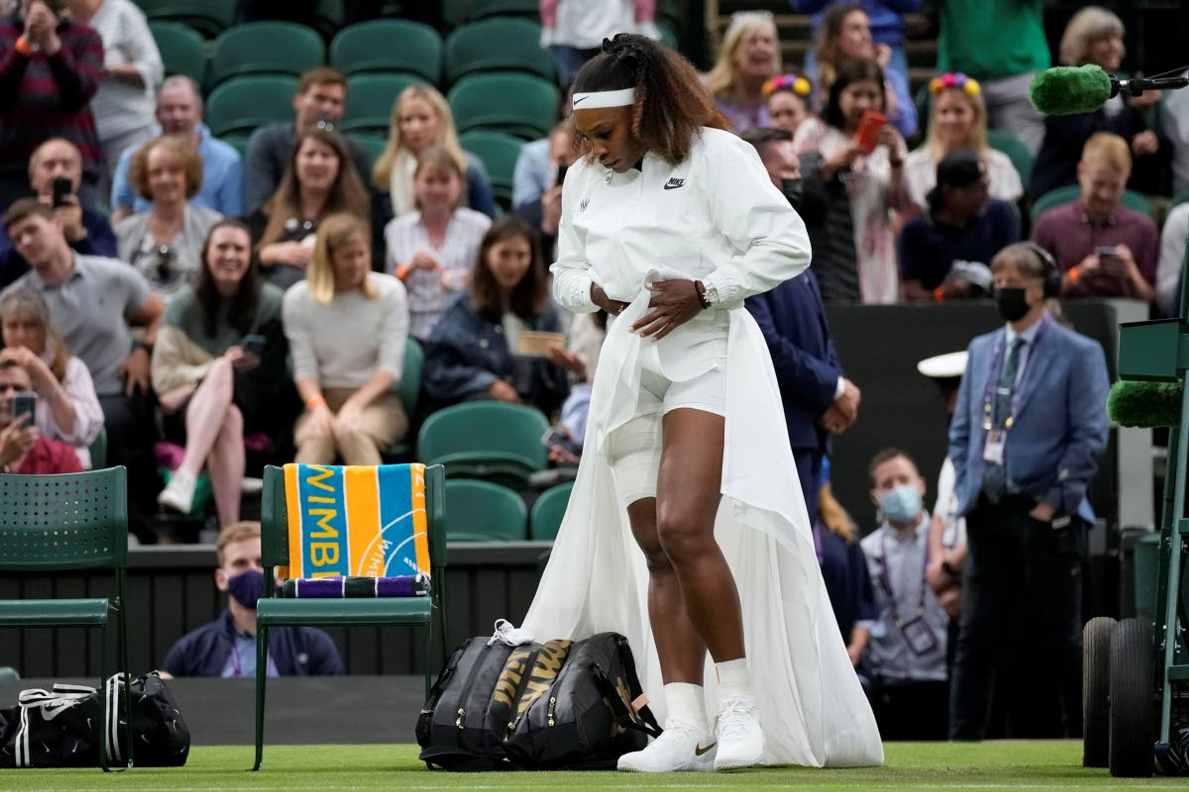 Serena Williams of the US walks onto Centre Court for the women's singles first round match against Aliaksandra Sasnovich of Belarus on day two of the Wimbledon Tennis Championships in London, Tuesday June 29, 2021. (AP Photo/Kirsty Wigglesworth)