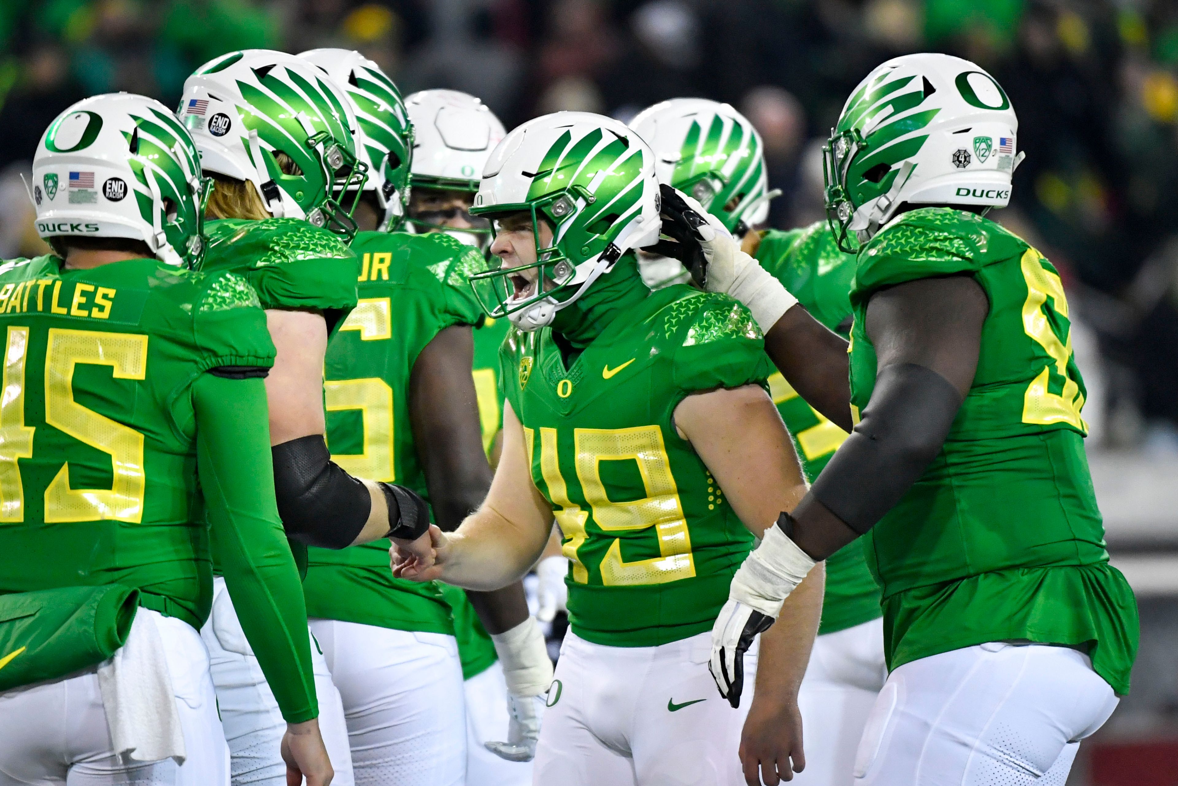 Oregon place-kicker Camden Lewis (49) celebrates with teammates after kicking a field goal against Utah during the second half of a game Nov. 19 in Eugene, Ore. The Big Ten has cleared the way for Oregon and Washington to apply for membership on Friday.