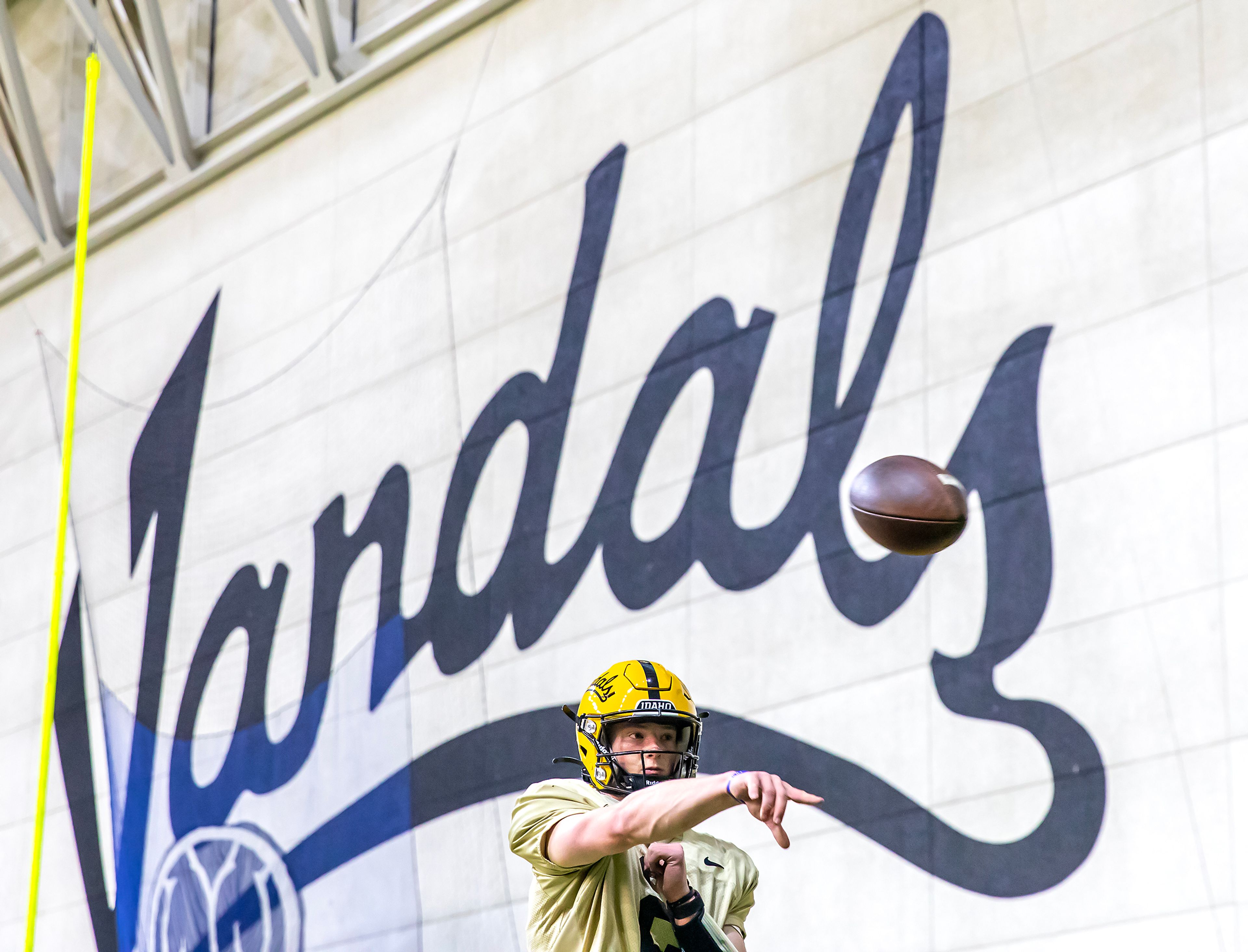 Idaho quarterback Jack Layne throws the ball into a net during a practice on April 2 at the Kibbie Dome in Moscow.