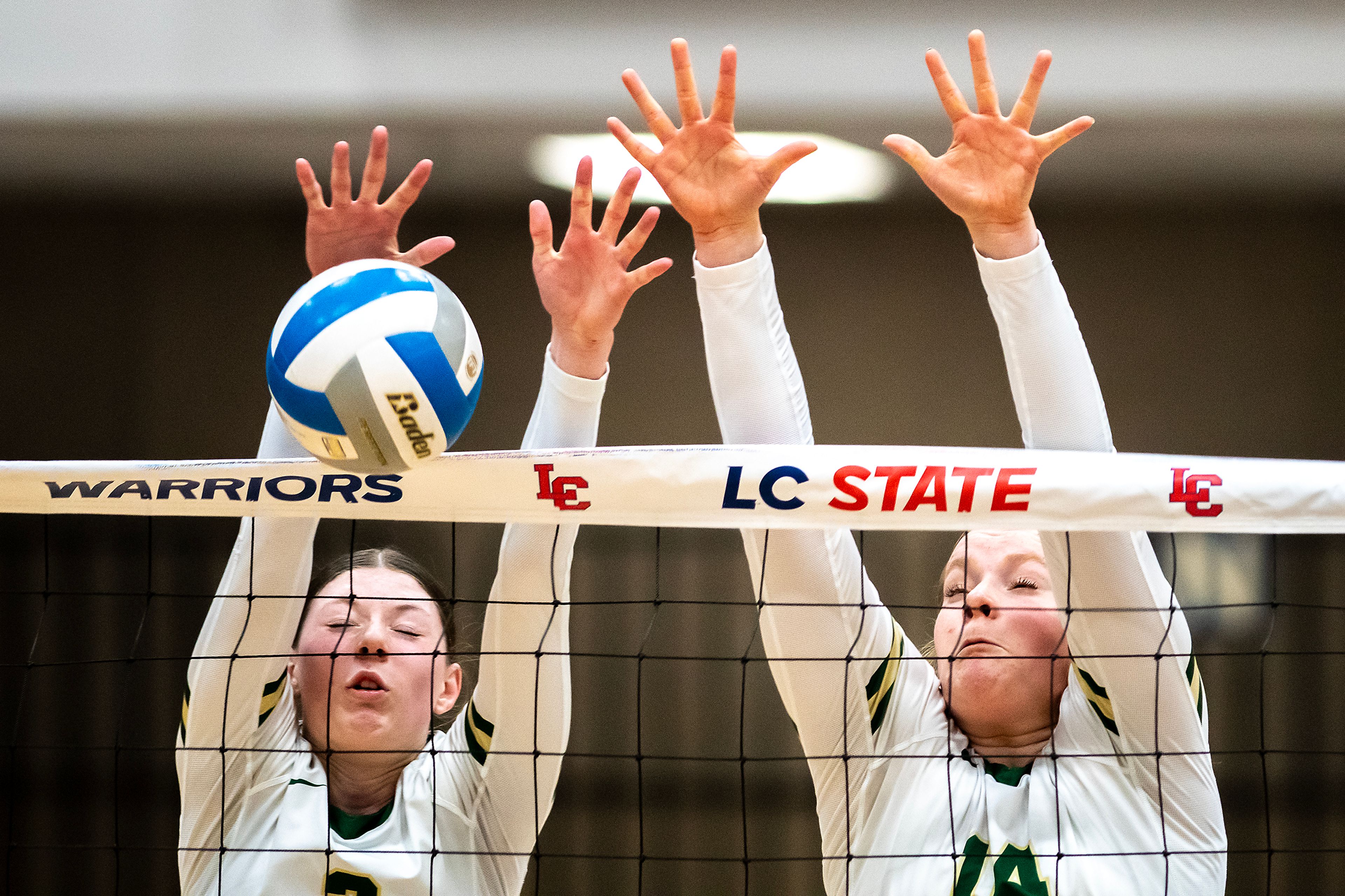 Potlatch middle blocker Kathy Burnette, right, and a teammate attempt to block a Troy ball during a 2A district championship Wednesday at the P1FCU Activity Center in Lewiston.