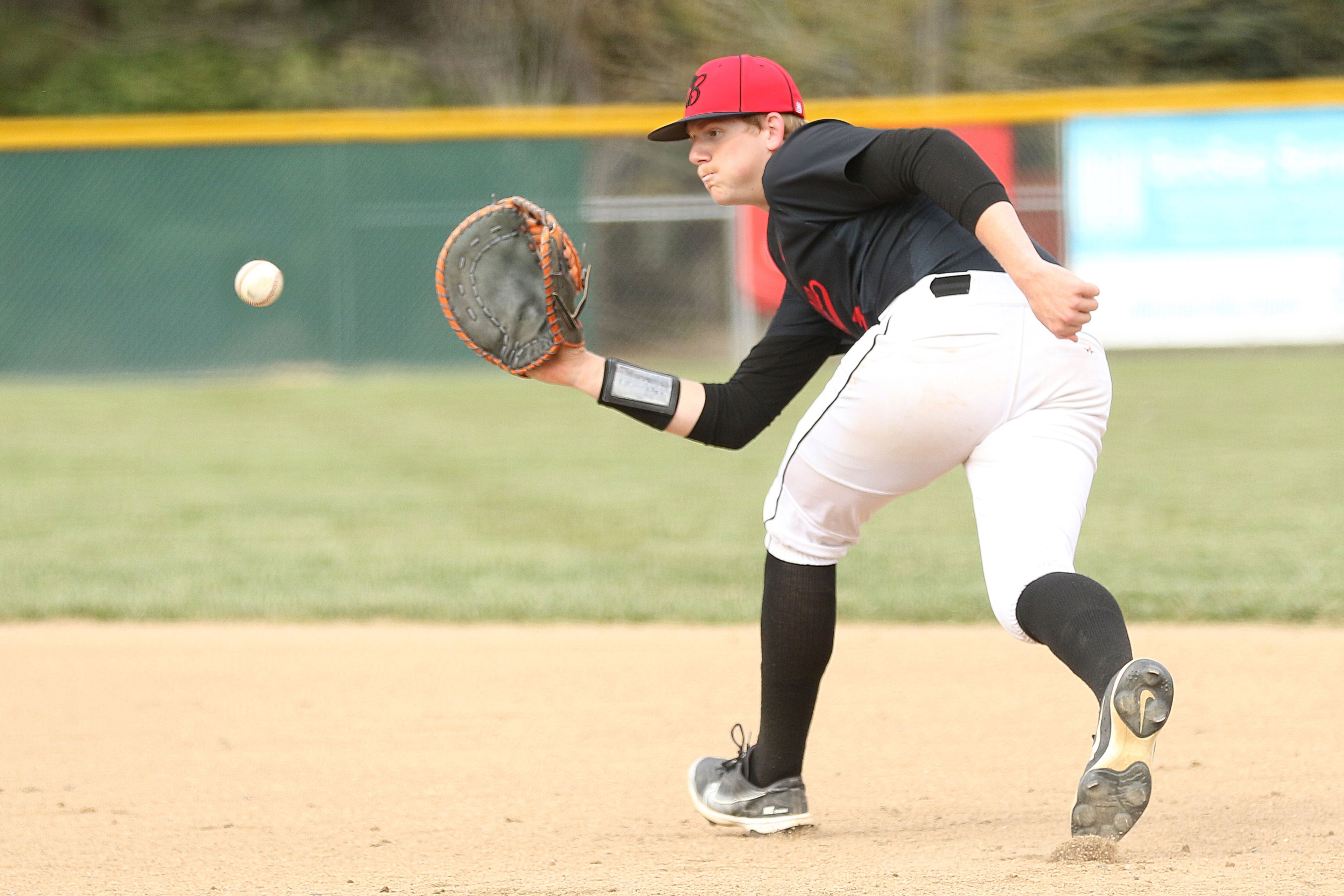 Moscow first baseman Levi Anderson catches a line drive during an Idaho Class 4A district championship game against Sandpoint on Wednesday in Moscow.