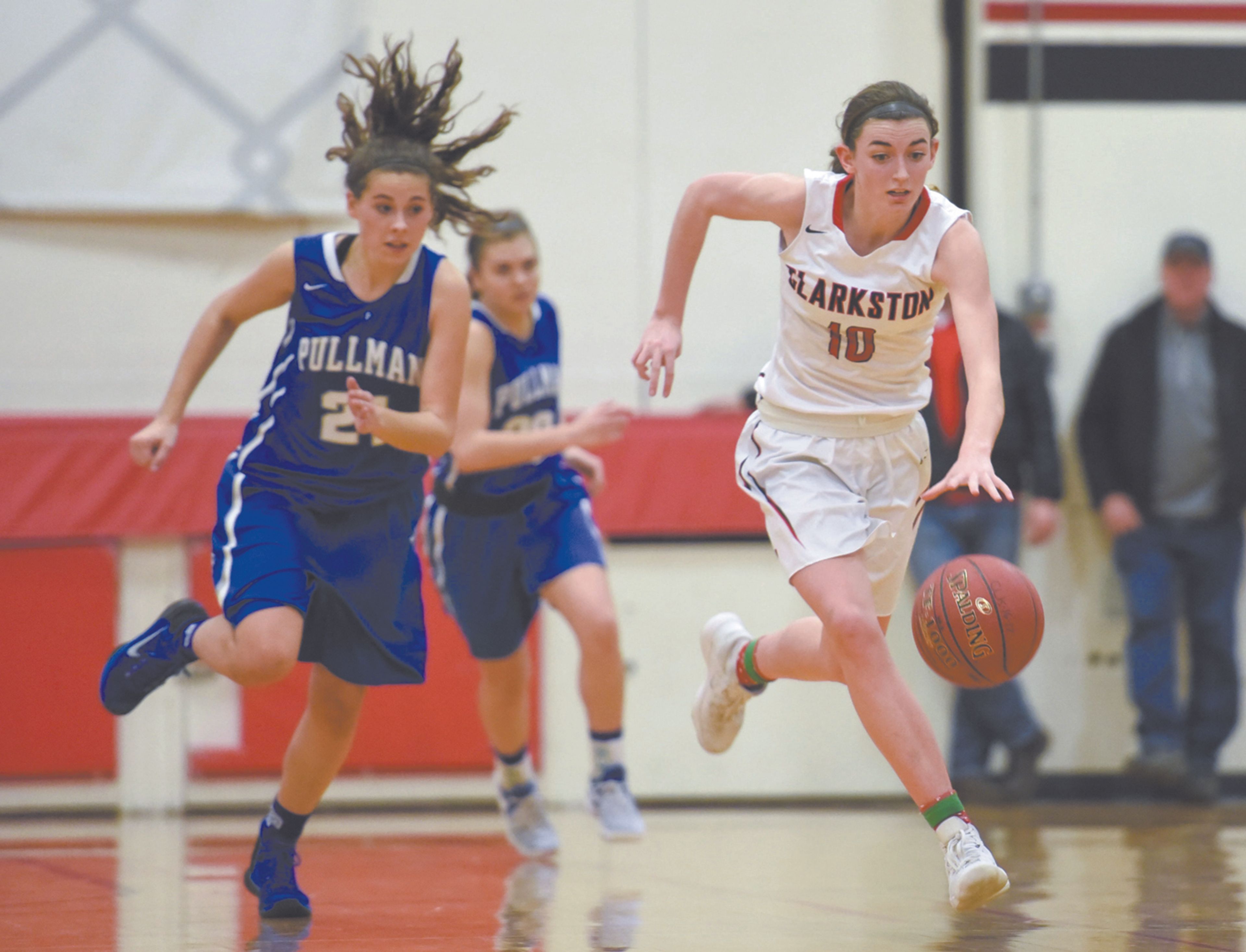 Clarkston's Makinzie Packwood steals a Pullman pass and dribbles up court for a layup late in the fourth quarter of a Great Northern League game on Wednesday in Clarkston.