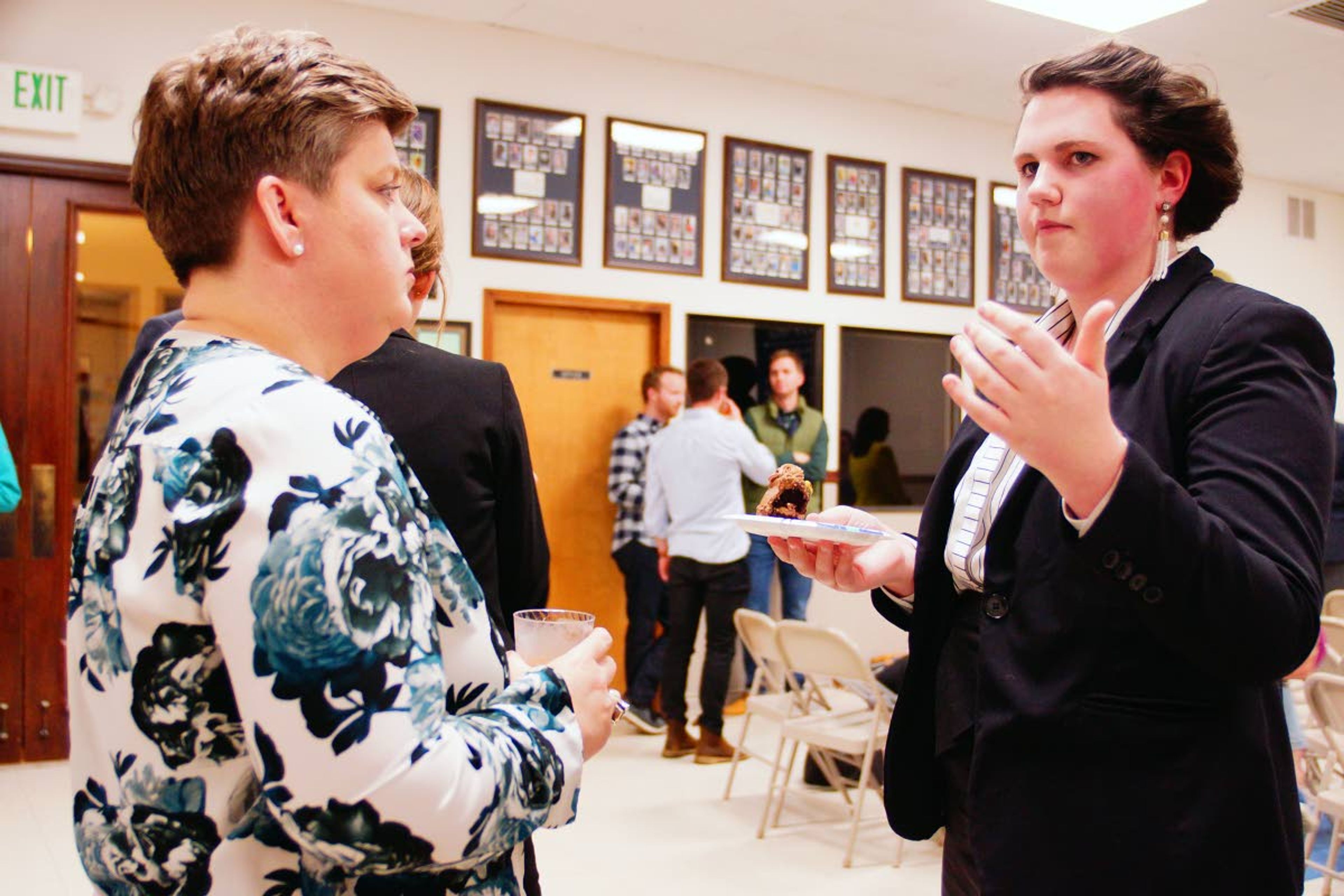 Logos mock trial team member Ellie Story talks with Idaho Supreme Court Justice Robyn Brody after an awards ceremony last week in Moscow.