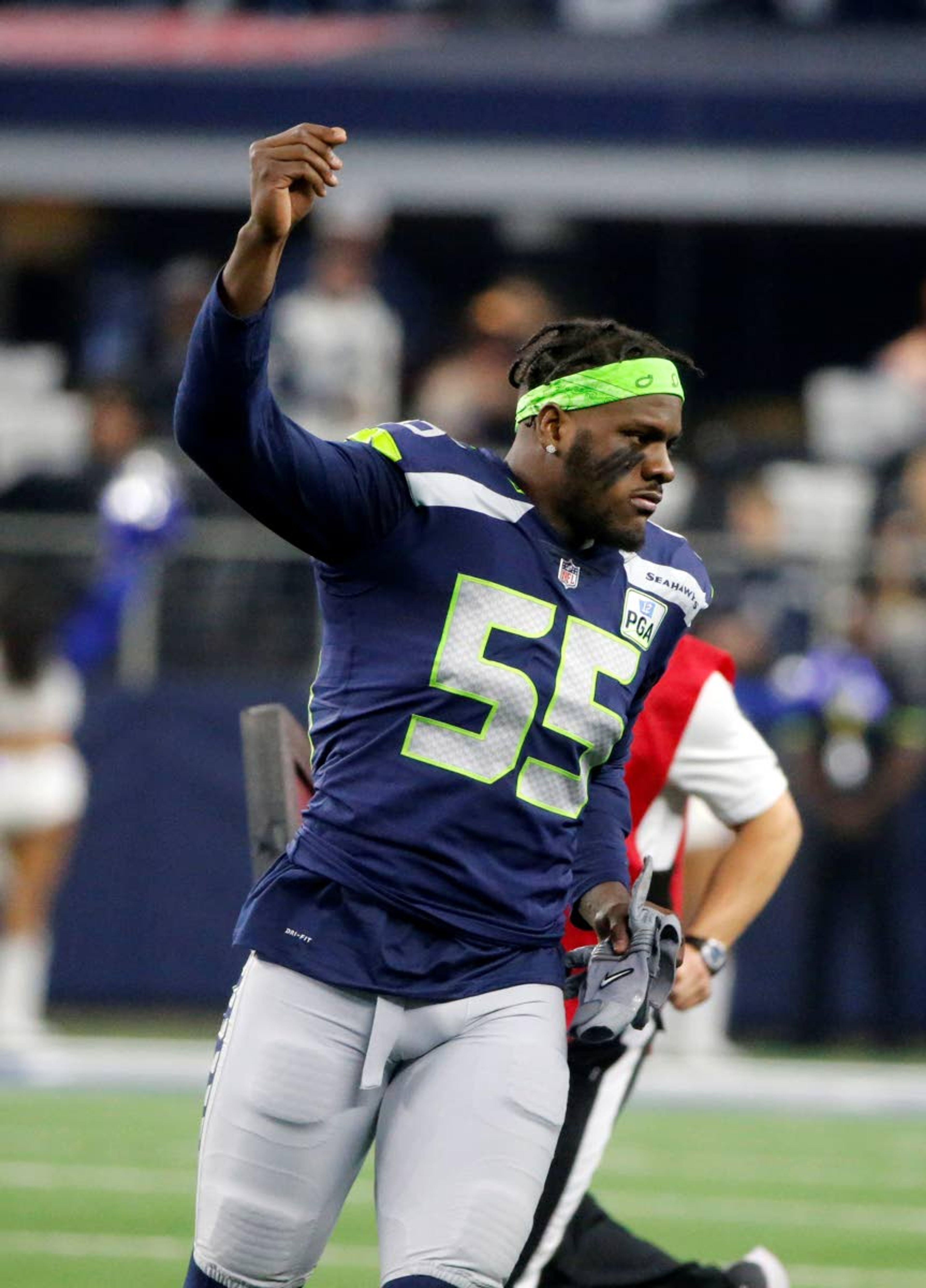 Seattle Seahawks defensive end Frank Clark (55) jogs onto the field for an NFC wild-card NFL football game against the Dallas Cowboys in Arlington, Texas, Saturday, Jan. 5, 2019.(AP Photo/Michael Ainsworth)