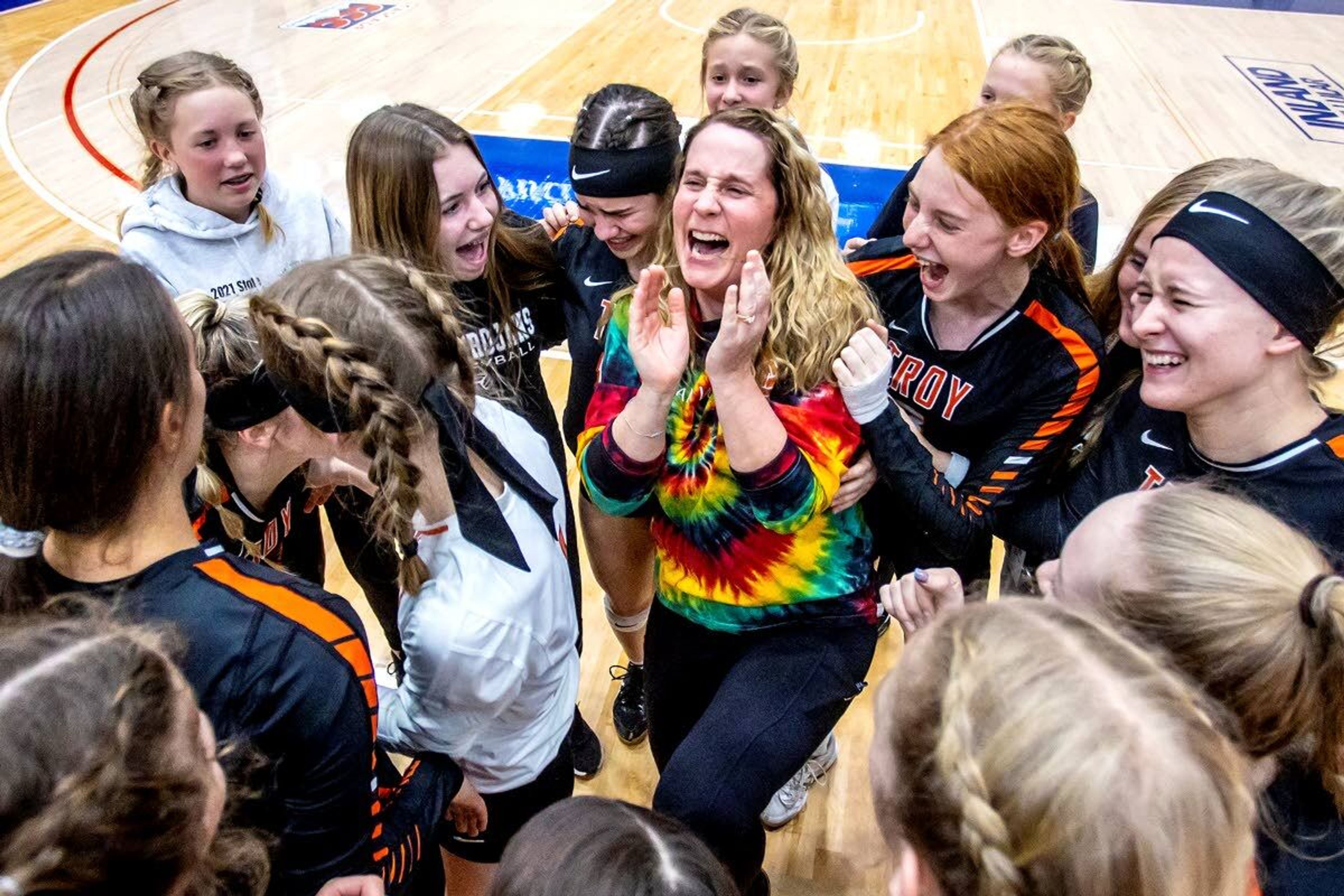 Troy celebrates its 25-12, 25-15, 25-12 victory against Grace in the Idaho Class 1A Division I state championship match Saturday at Lewis-Clark State’s Activity Center.