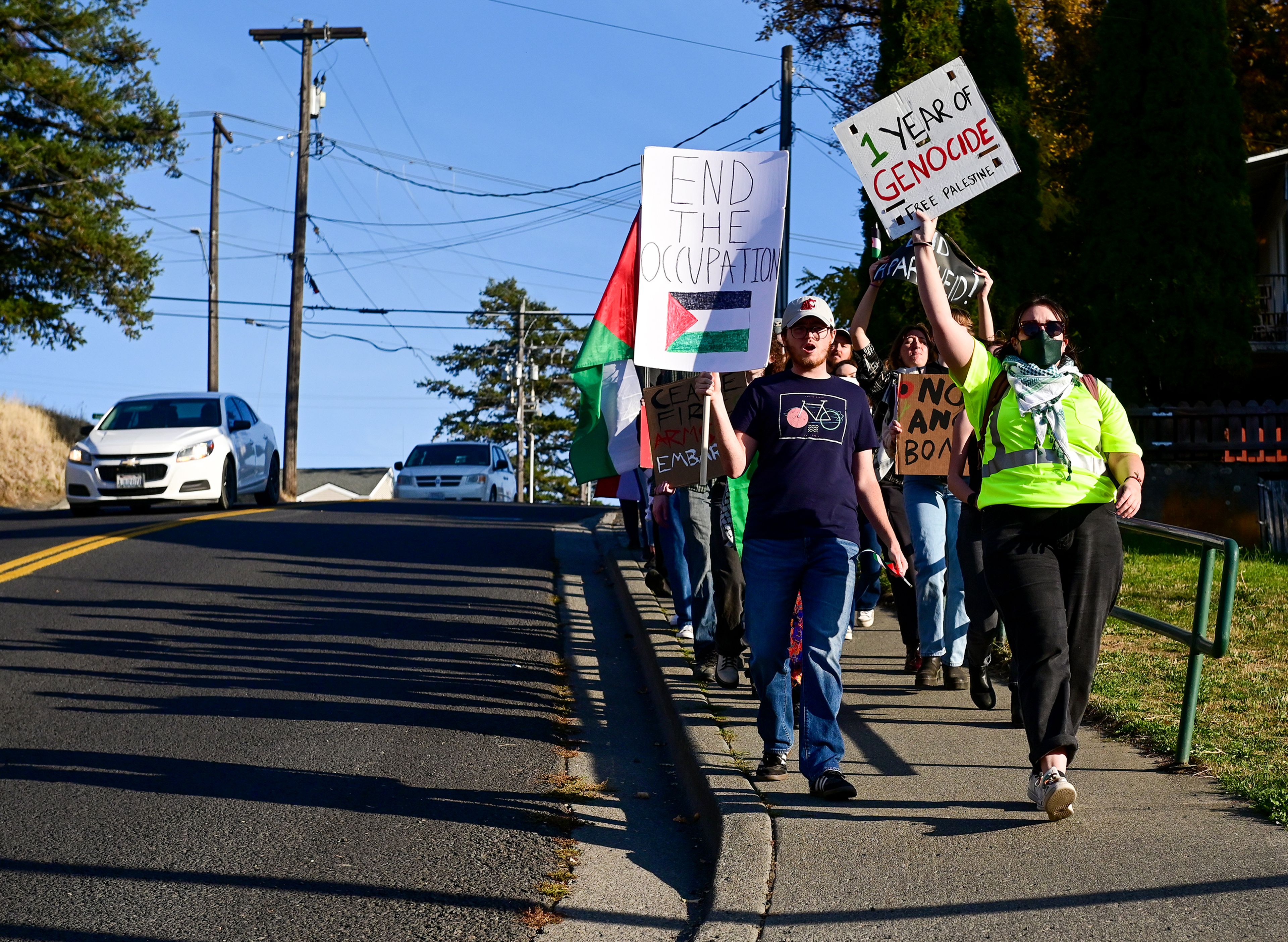 A group marching in solidarity with Palestinian makes their way down Northeast Whitman Street after gathering for a rally on Washington State University campus Monday in Pullman.