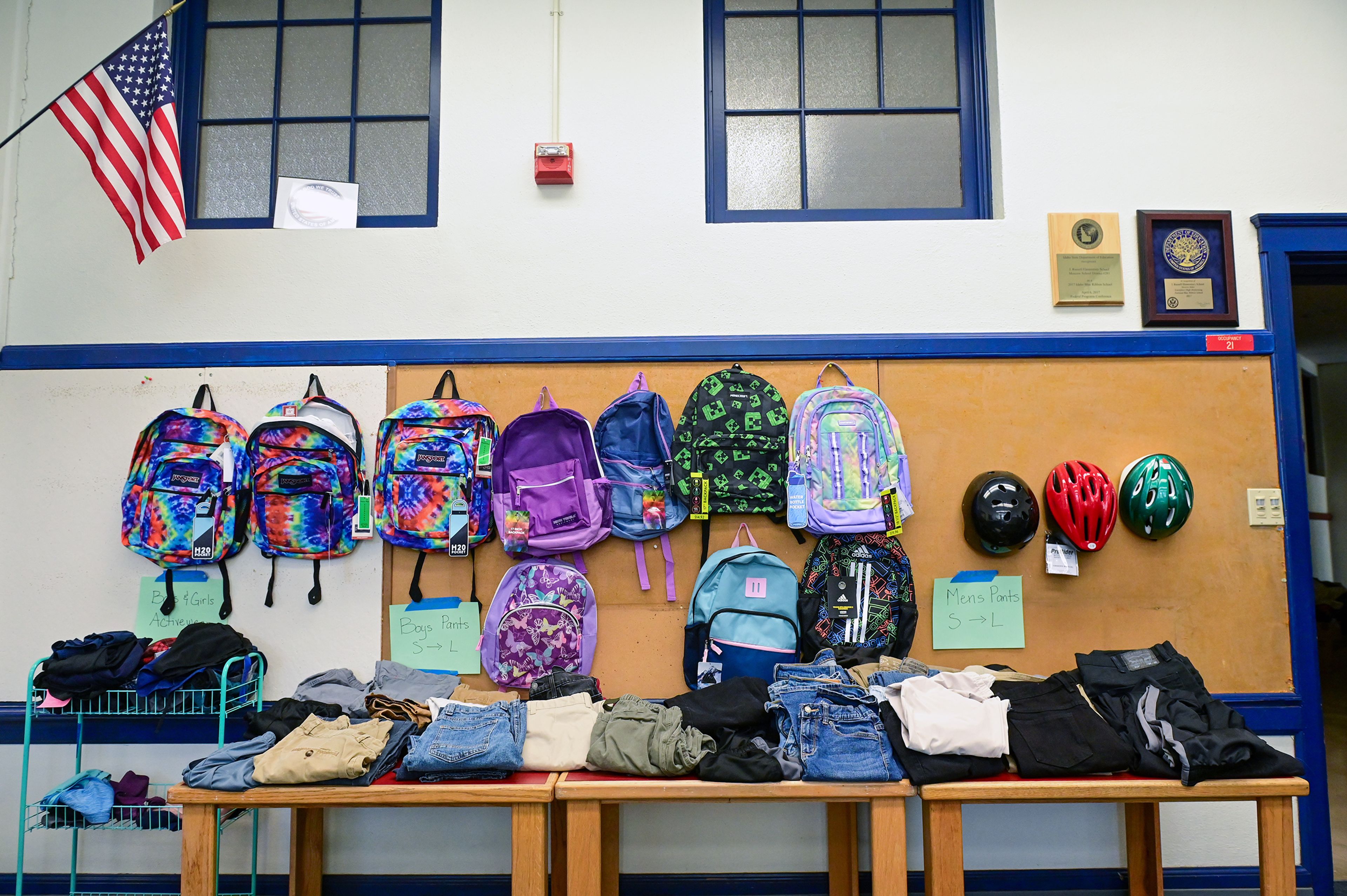 A variety of items fill one wall of the Moscow School District Family Resource Hub in the Russell Elementary building Thursday in Moscow. Pants for teens have been some of the most in-demand items so far.