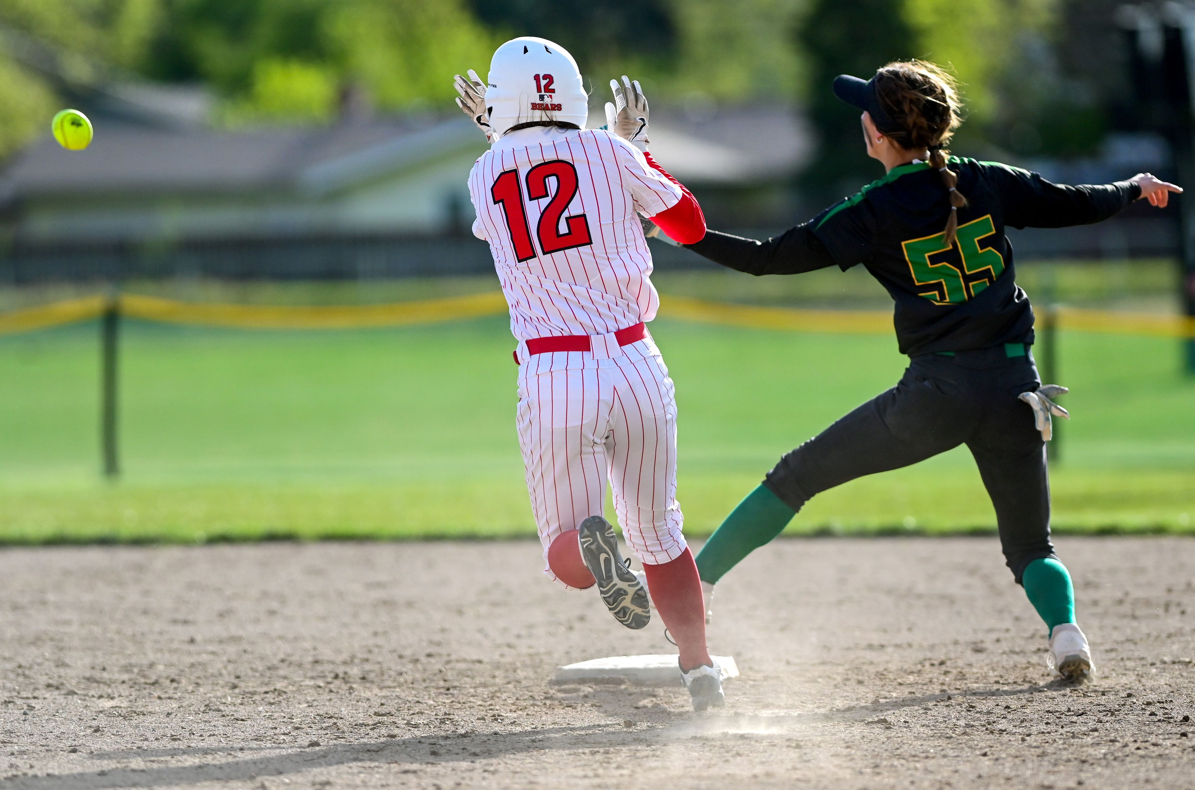 Moscow’s Sammy Pfiffner (12) races against a throw to safely reach second base in Moscow on Tuesday.