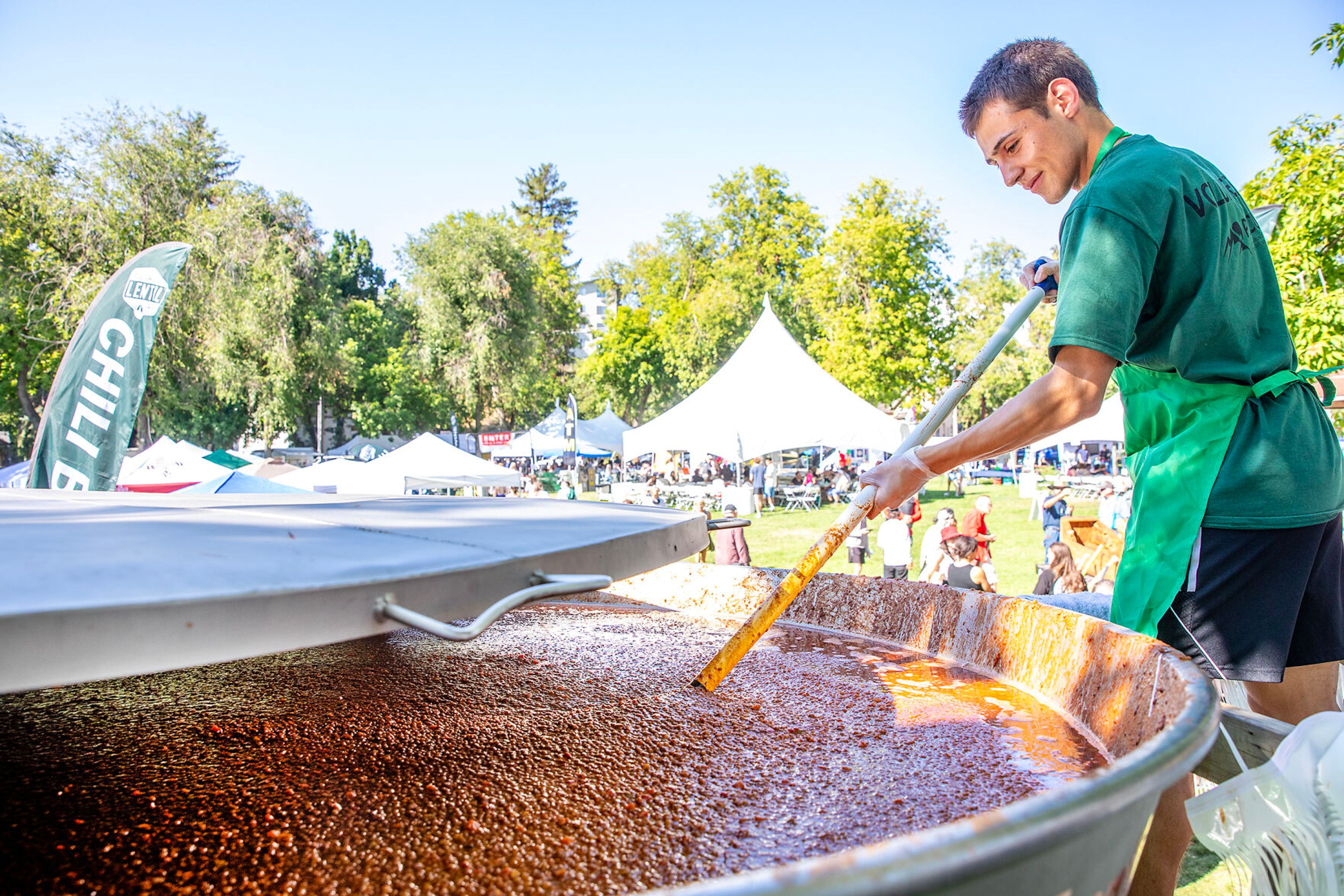 Leonardo Hoffman, of Pullman stirs a giant pot of Lentil Chili Saturday at Lentil fest in Reaney Park in Pullman.