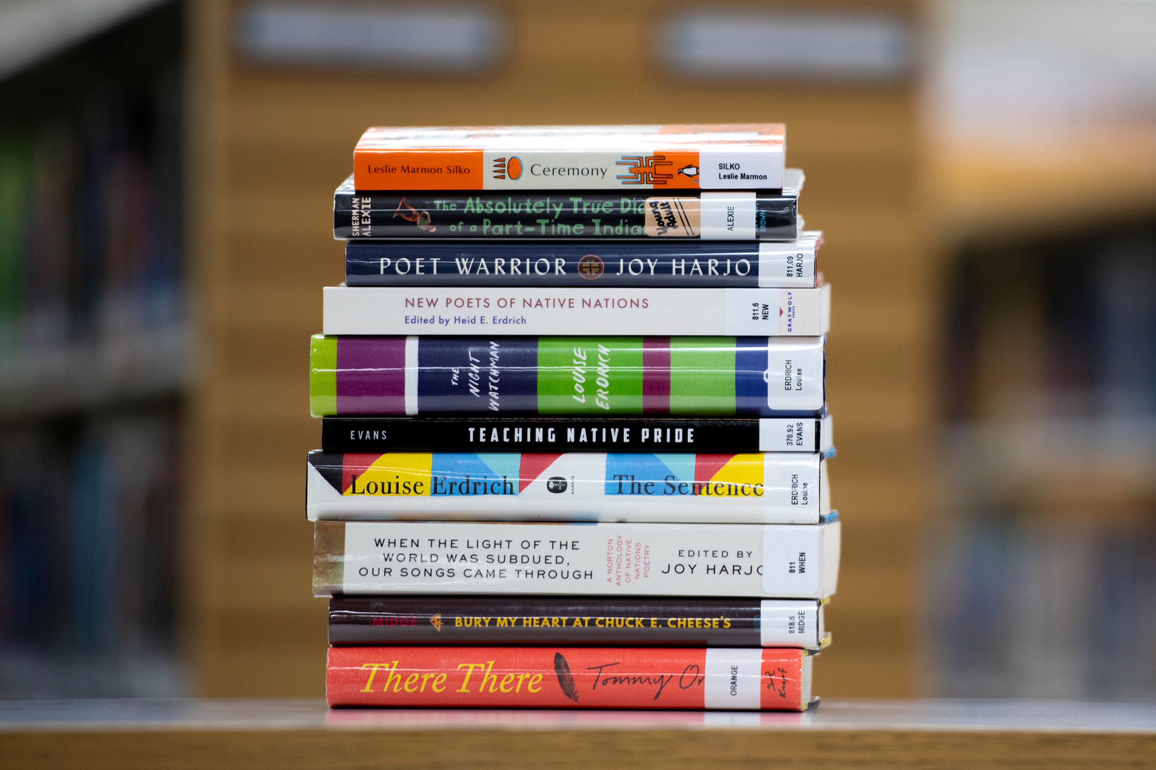 A collection of new books in honor of Native American Heritage Month are stacked Wednesday on a table at the Neill Public Library in Pullman.